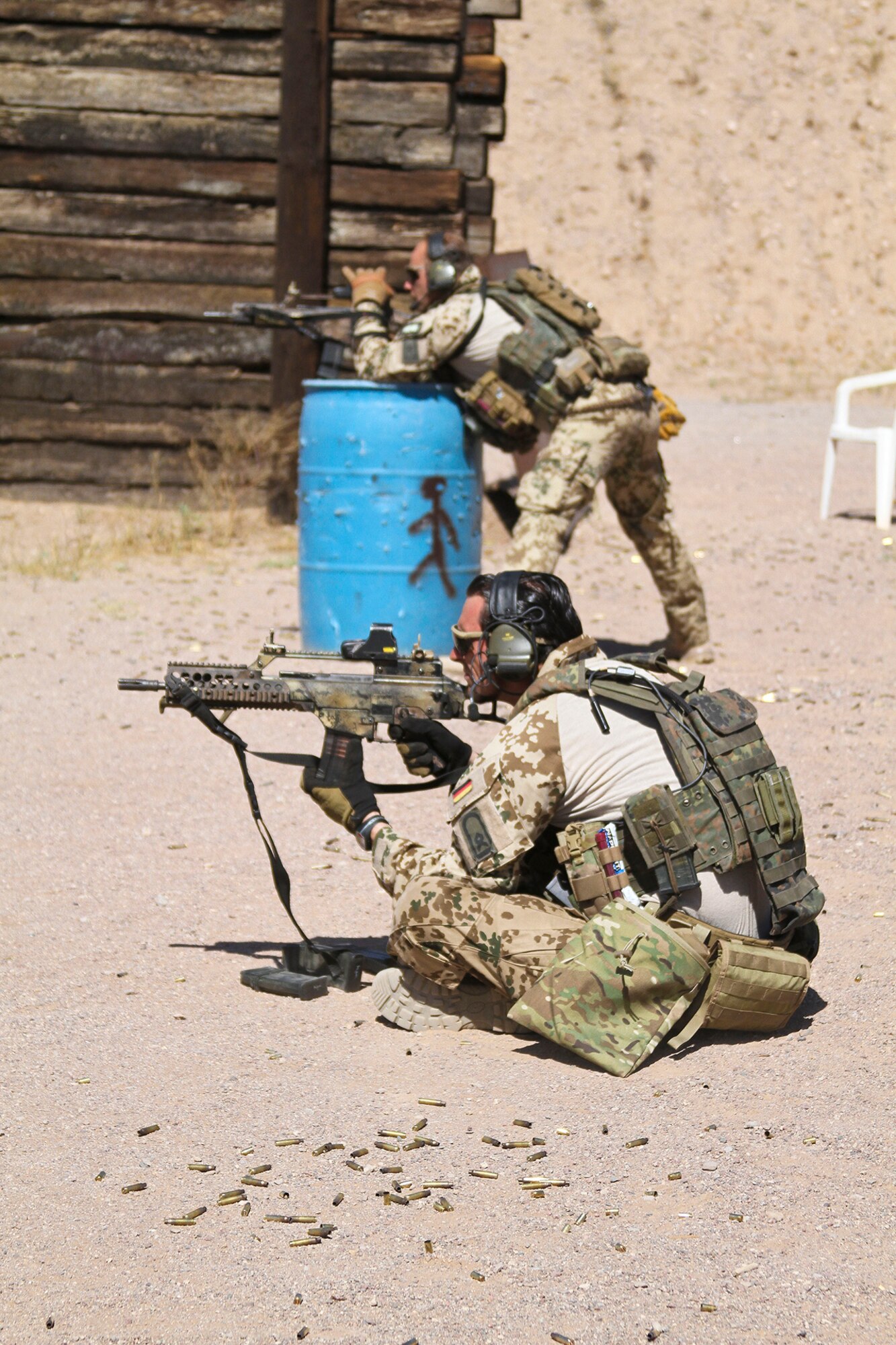 U.S. Airmen and Marines, along with German and Swedish Air Force Rangers, train together on various shooting tactics during Exercise ANGEL THUNDER at Three Points Firing Range in Tucson, Ariz., May 12, 2014.  ANGEL THUNDER is the only exercise in the Department of Defense covering personnel recovery training across the full spectrum of irregular and conventional warfare and has become the world’s largest and most complex personnel recovery exercise. Through the use of joint training, members are able to hone their development of the four core functions of personnel recovery which include preparing, planning, execution, and adaptation. ANGEL THUNDER is designed to provide state of the art rescue training for the total Air Force rescue community, as well as Joint U.S. Military, federal government agencies, local communities, non-governmental agencies and allied nations.  (U.S. Air Force photo by Tech. Sgt. Heather R. Redman/Released)