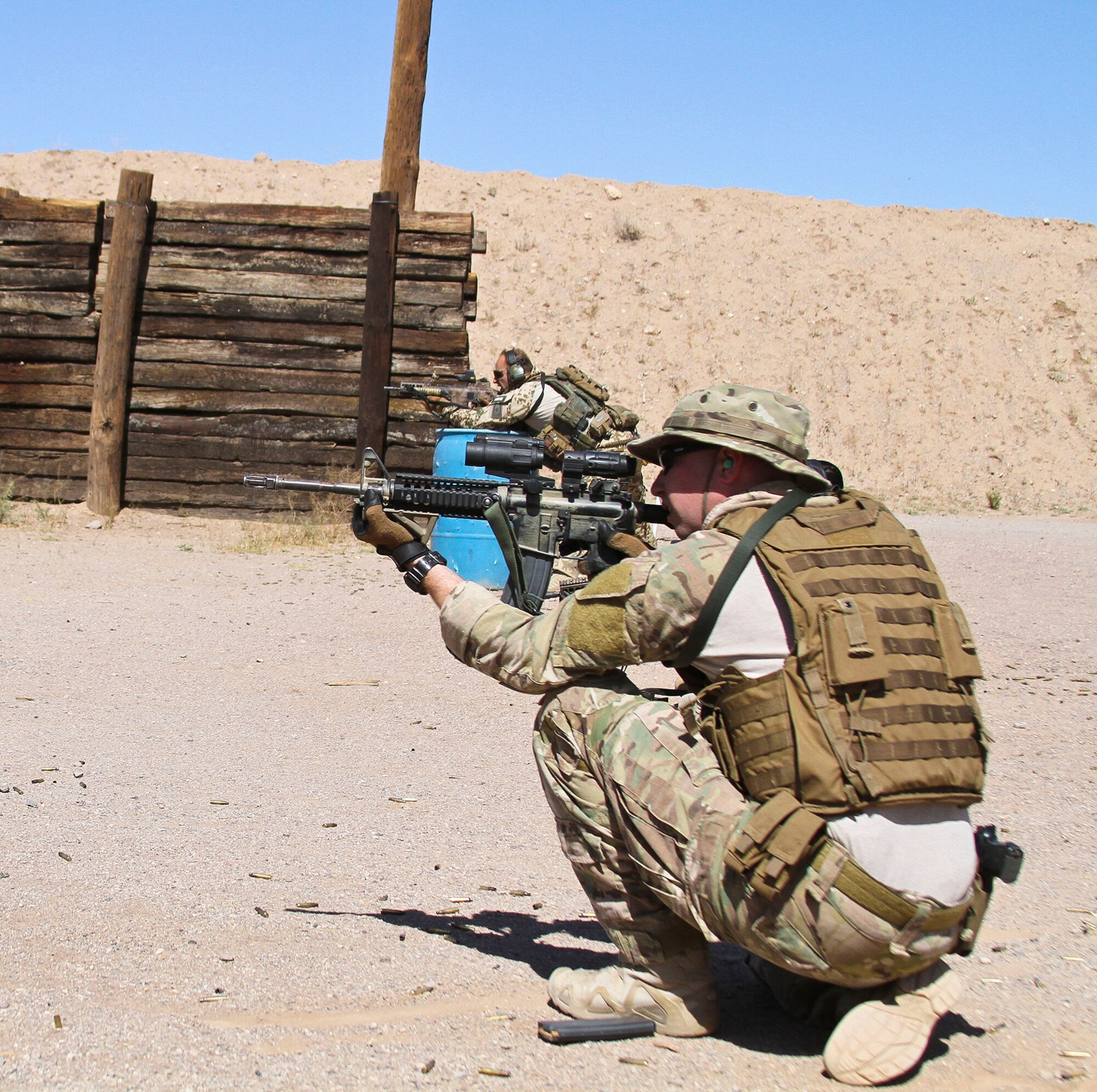 U.S. Airmen and Marines, along with German and Swedish Air Force Rangers, train together on various shooting tactics during Exercise ANGEL THUNDER at Three Points Firing Range in Tucson, Ariz., May 12, 2014.  ANGEL THUNDER is the only exercise in the Department of Defense covering personnel recovery training across the full spectrum of irregular and conventional warfare and has become the world’s largest and most complex personnel recovery exercise. Through the use of joint training, members are able to hone their development of the four core functions of personnel recovery which include preparing, planning, execution, and adaptation. ANGEL THUNDER is designed to provide state of the art rescue training for the total Air Force rescue community, as well as Joint U.S. Military, federal government agencies, local communities, non-governmental agencies and allied nations.  (U.S. Air Force photo by Tech. Sgt. Heather R. Redman/Released)