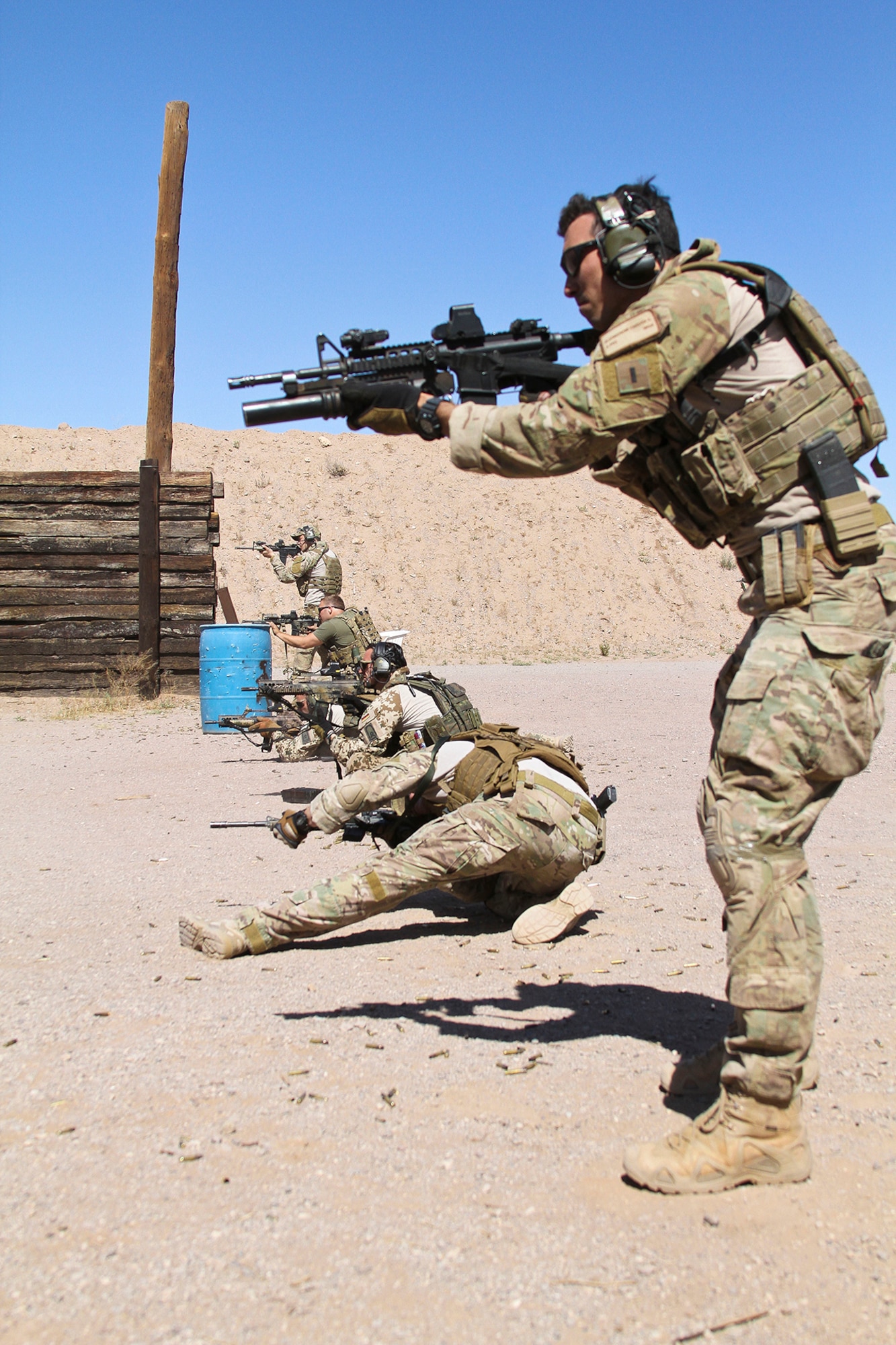 U.S. Airmen and Marines, along with German and Swedish Air Force Rangers, train together on various shooting tactics during Exercise ANGEL THUNDER at Three Points Firing Range in Tucson, Ariz., May 12, 2014.  ANGEL THUNDER is the only exercise in the Department of Defense covering personnel recovery training across the full spectrum of irregular and conventional warfare and has become the world’s largest and most complex personnel recovery exercise. Through the use of joint training, members are able to hone their development of the four core functions of personnel recovery which include preparing, planning, execution, and adaptation. ANGEL THUNDER is designed to provide state of the art rescue training for the total Air Force rescue community, as well as Joint U.S. Military, federal government agencies, local communities, non-governmental agencies and allied nations.  (U.S. Air Force photo by Tech. Sgt. Heather R. Redman/Released)