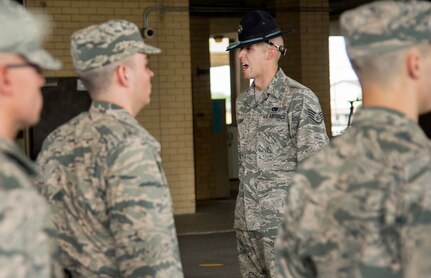 Staff Sgt. Eddie Glover, delivers commands to flight of basic trainees at the 322nd Training Squadron April 17, at Joint Base San Antonio-Lackland. Staff Sgt. Glover was named the 2014 Military Training Instructor of the Year.  (U.S. Air Force photo by Benjamin Faske) (released)