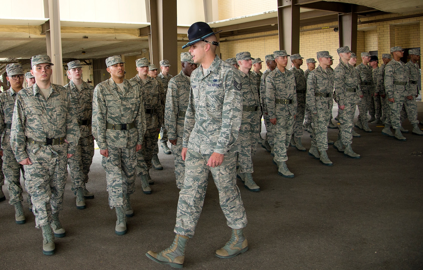 Staff Sgt. Eddie Glover, inspects a flight of trainees at the 322nd Training Squadron April 17, at Joint Base San Antonio-Lackland. Staff Sgt. Glover was named the 2014 Military Training Instructor of the Year.  (U.S. Air Force photo by Benjamin Faske) (released)