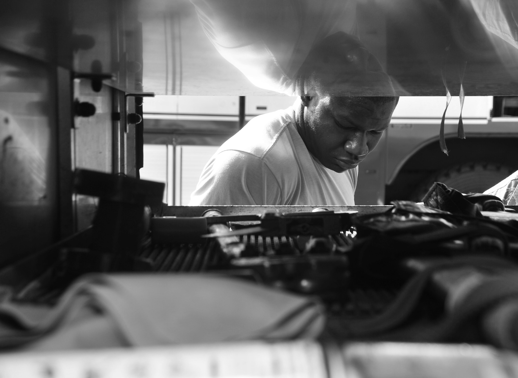 Airman 1st Class Freddie Foust, 325th Civil Engineering Squadron fire protection journeyman, inspects equipment on a fire truck May 8 at Tyndall’s Fire Station 1. The firefighters wake up every other morning to get ready for roll call at 6:55 a.m., before starting a 24-hour work day. (U.S. Air Force photo by Airman 1st Class Sergio A. Gamboa)