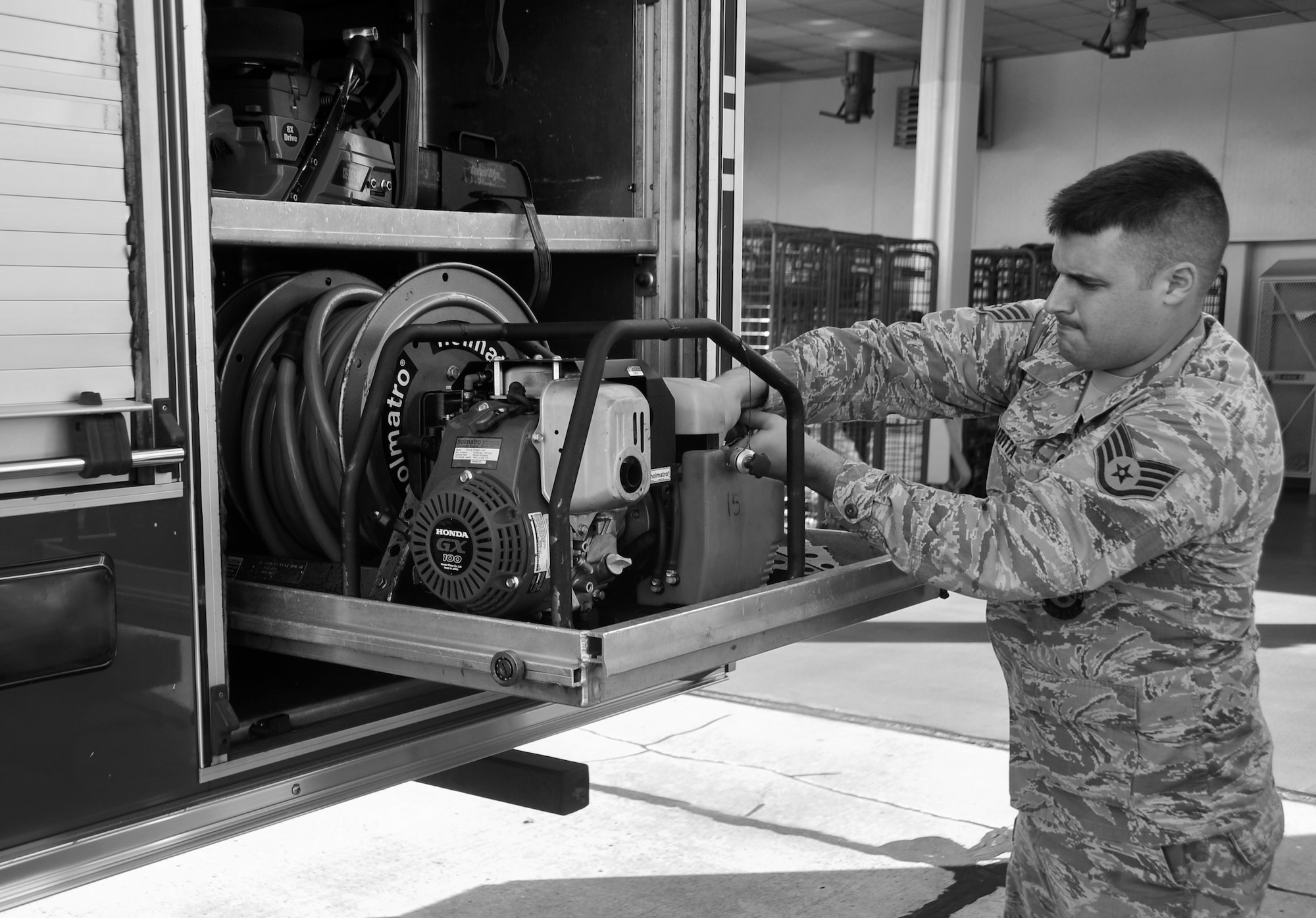 Staff Sgt. Jacob Butitta, 325th Civil Engineering Squadron fire protection crew chief, inspects equipment on a fire truck May 8 at Tyndall’s Fire Station 1. The firefighters wake up every other morning to get ready for roll call at 6:55 a.m., before starting a 24-hour work day. (U.S. Air Force photo by Airman 1st Class Sergio A. Gamboa)