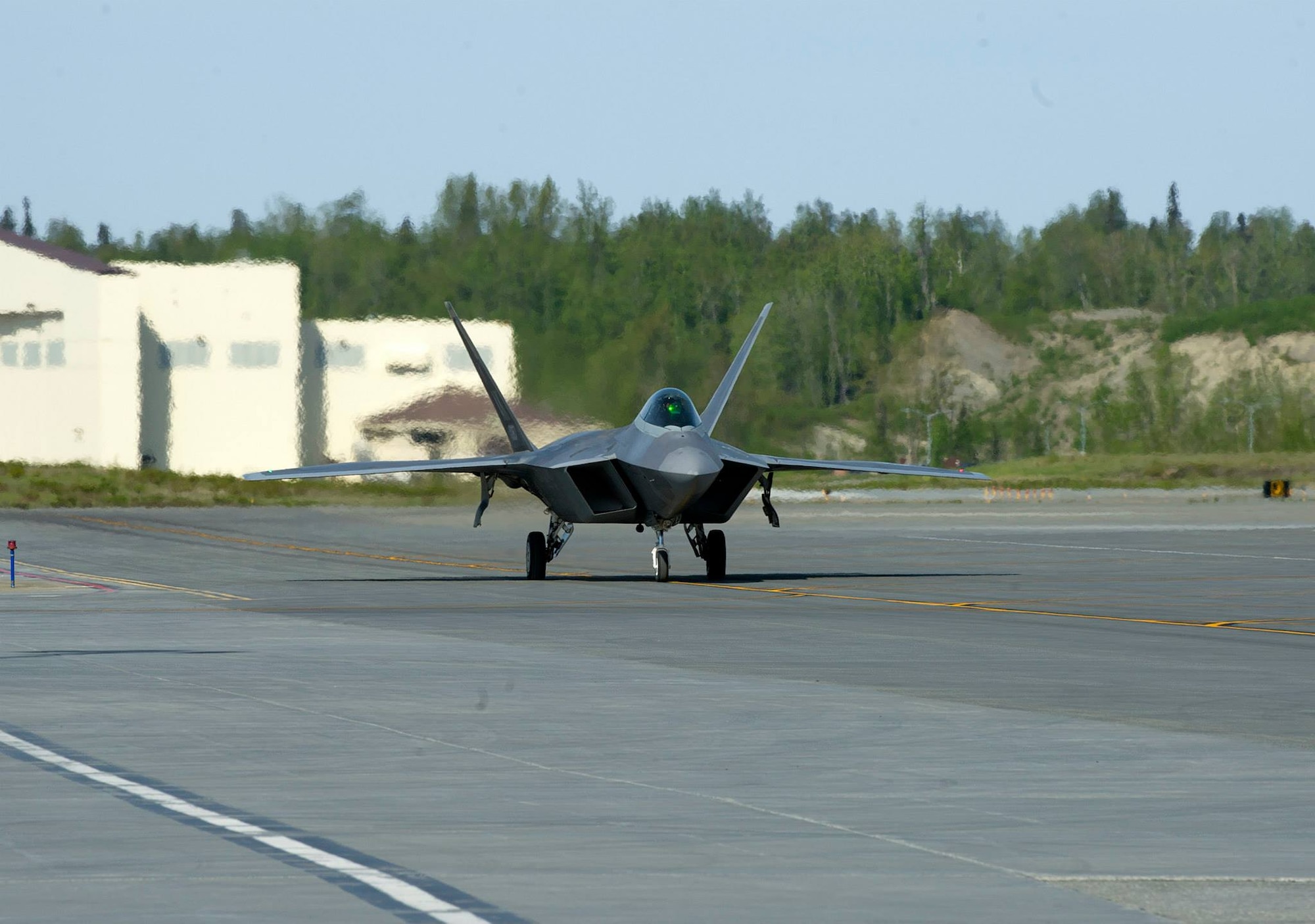 An F-22 Raptor taxis to its parking spot on Joint Base Elmendorf-Richardson, Alaska, May 14, 2014. The Raptor flew as part of Red Flag, which is conducted three to four times a year at JBER and Eielson Air Force Base. (U.S. Air Force photo/Staff Sgt. Zachary Wolf)
