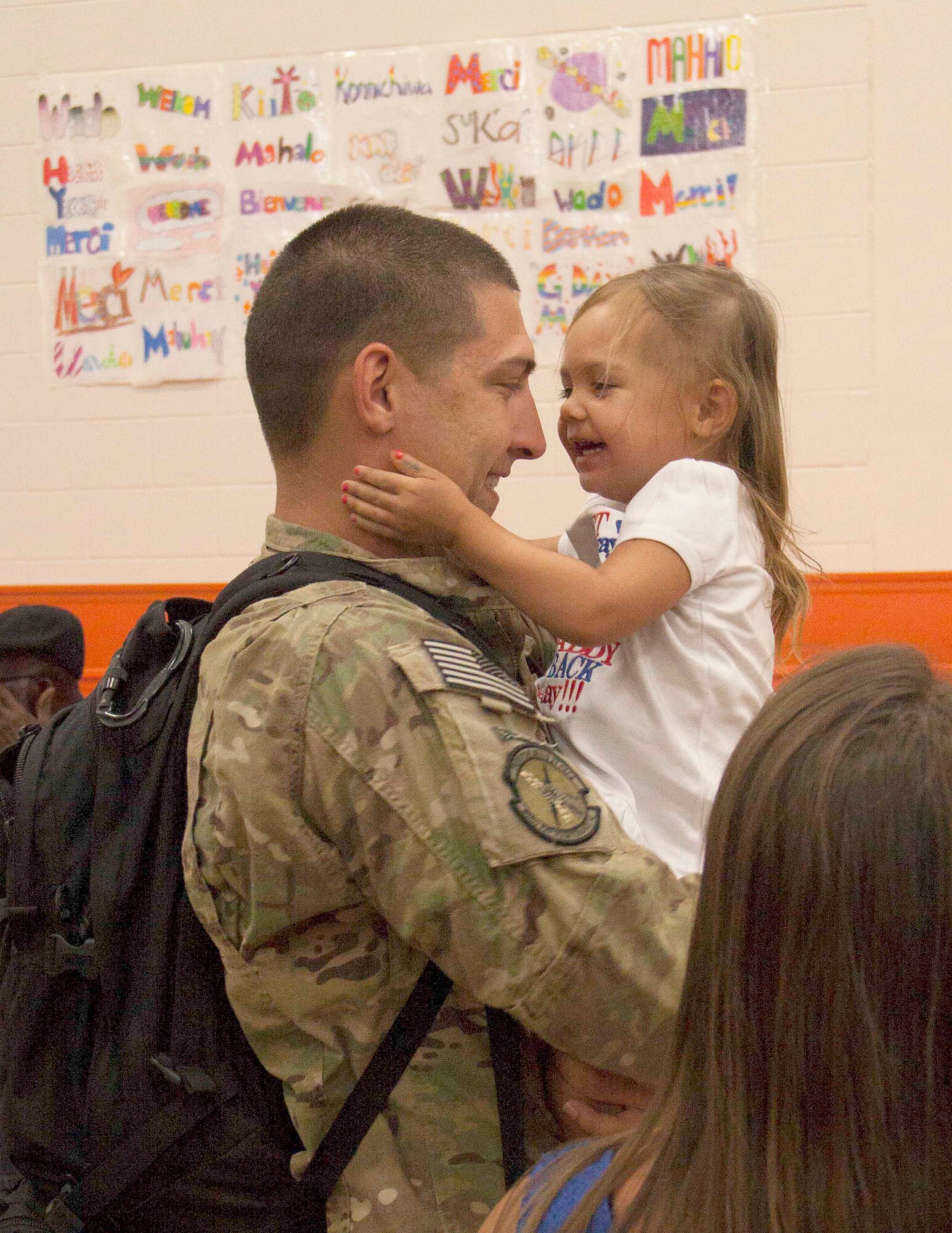 Staff Sgt. Joshua Barnes, 495th Fighter Group, Det. 93, catches his
daughter, Emmaleigh Barnes, in a tight embrace upon seeing her for the first
time in months at Homestead Air Reserve Base's Sam Johnson Fitness Center.
Barnes was one of over 200 service members who returned from supporting
wartime operations in Afghanistan May 9. (U.S. Air Force photo/Senior Airman Jaimi
Upthegrove)
