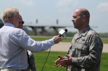 A local media representative interviews Col. James Dignan, 910th Airlift Wing commander, May 13, about the upcoming air show. The 2014 Thunder Over the Valley Air Show and Open House will be held May 17 and 18 here. (U.S. Air Force photo by Senior Airman Rachel Kocin)
