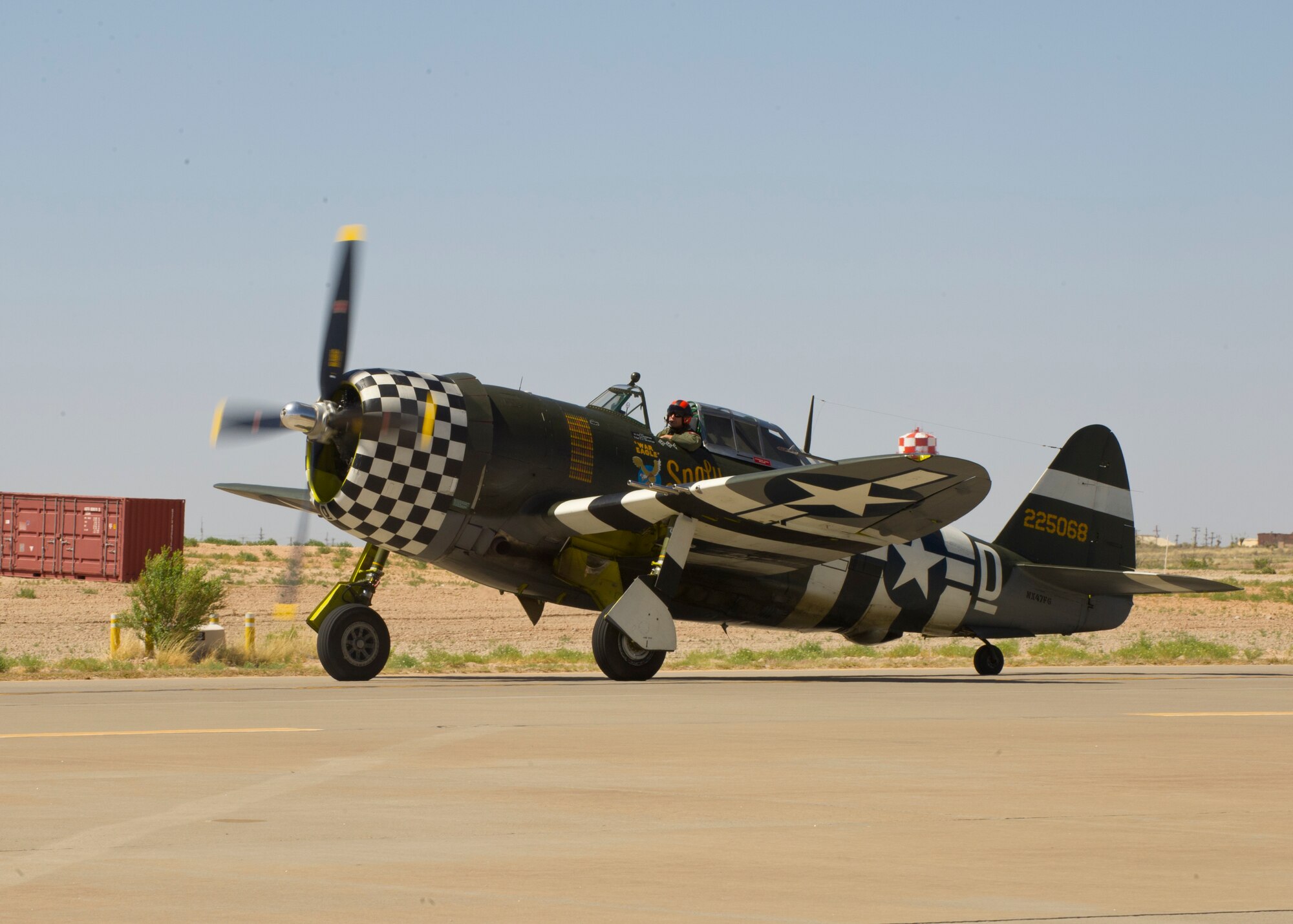 The P-47 Thunderbolt takes off for the heritage flight with the F-22 Raptor during the Open House event at Holloman Air Force Base, N.M., May 10. Team Holloman hosted an Open House showcasing over 50 aircraft and the day-to-day duties of Holloman Airmen. With live flying demonstrations and static displays, thousands of guests attended the event to get a close-up look at the base’s assets and capabilities. Guests were able to view various aircraft, visit numerous vendors, and witness ground demonstrations from squadrons around the base. (U.S. Air Force photo by Airman 1st Class Leah Ferrante/Released) 