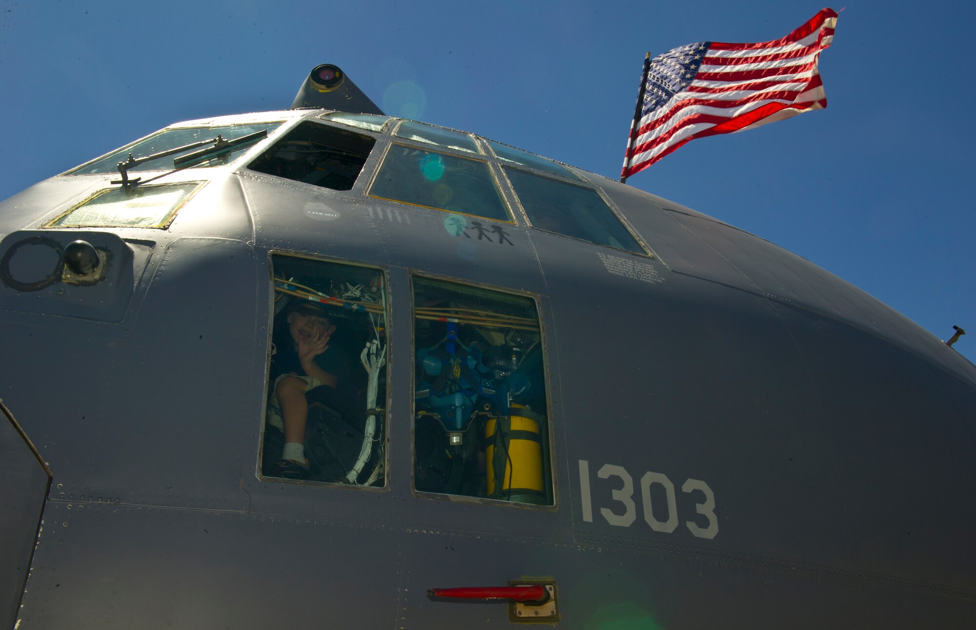 Guests tour the cockpit of the AC-130 Gunship during the Open House event at Holloman Air Force Base, N.M., May 10. Team Holloman hosted an Open House showcasing over 50 aircraft and the day-to-day duties of Holloman Airmen. With live flying demonstrations and static displays, thousands of guests attended the event to get a close-up look at the base’s assets and capabilities. Guests were able to view various aircraft, visit numerous vendors, and witness ground demonstrations from squadrons around the base. (U.S. Air Force photo by Airman 1st Class Leah Ferrante/Released) 