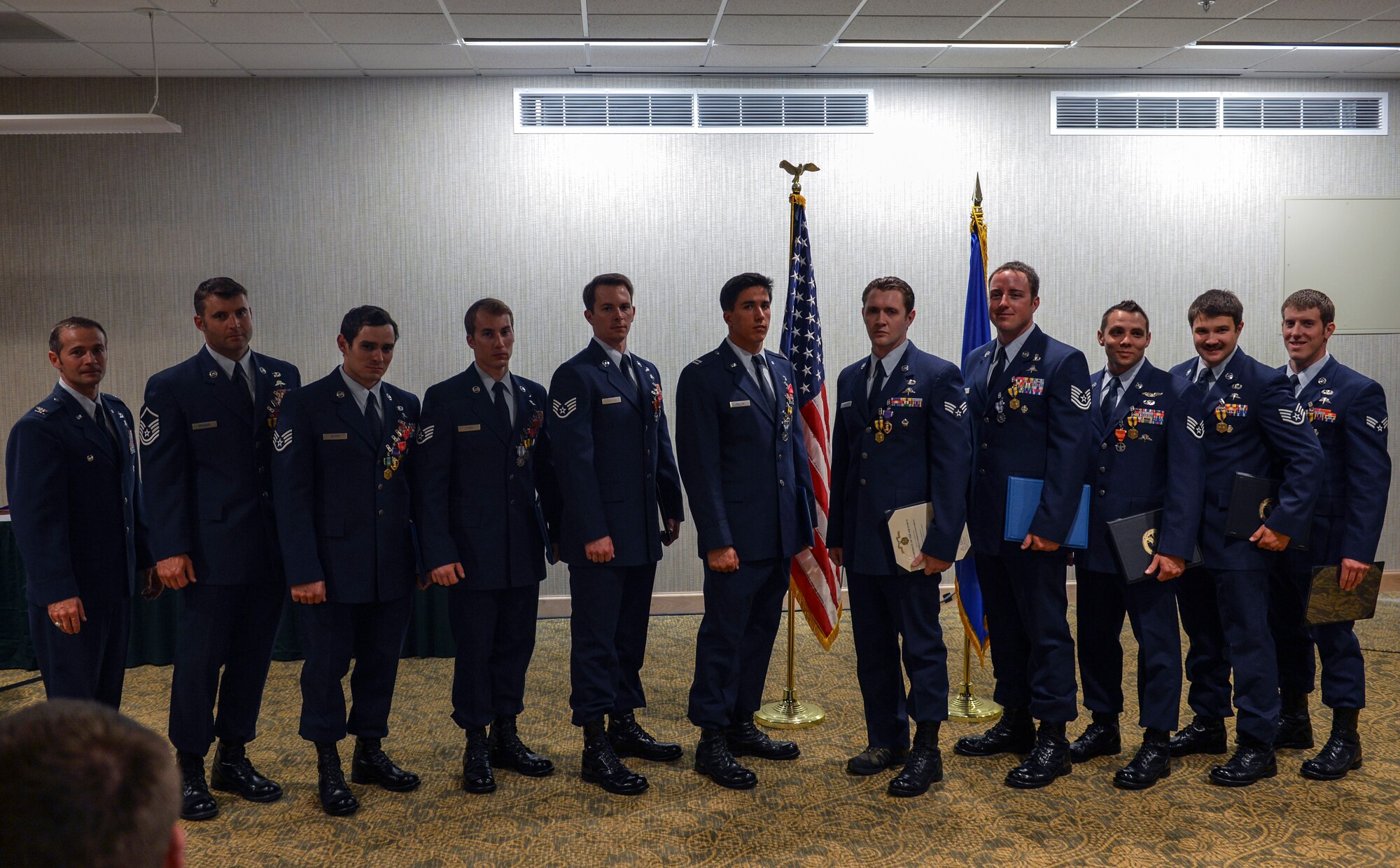 Col. Thad Allen, 22nd Special Tactics Squadron commander, honors Airmen from the 22nd STS red team, May 14, 2014, during the 22nd STS awards ceremony and dining-out at Joint Base Lewis-McChord, Wash. Members of the red team were awarded 22 Air Force medals to include five Bronze Star Medals with Valor, two Bronze Star Medals and two Purple Hearts. (U.S. Air Force photo/Staff Sgt. Russ Jackson)
