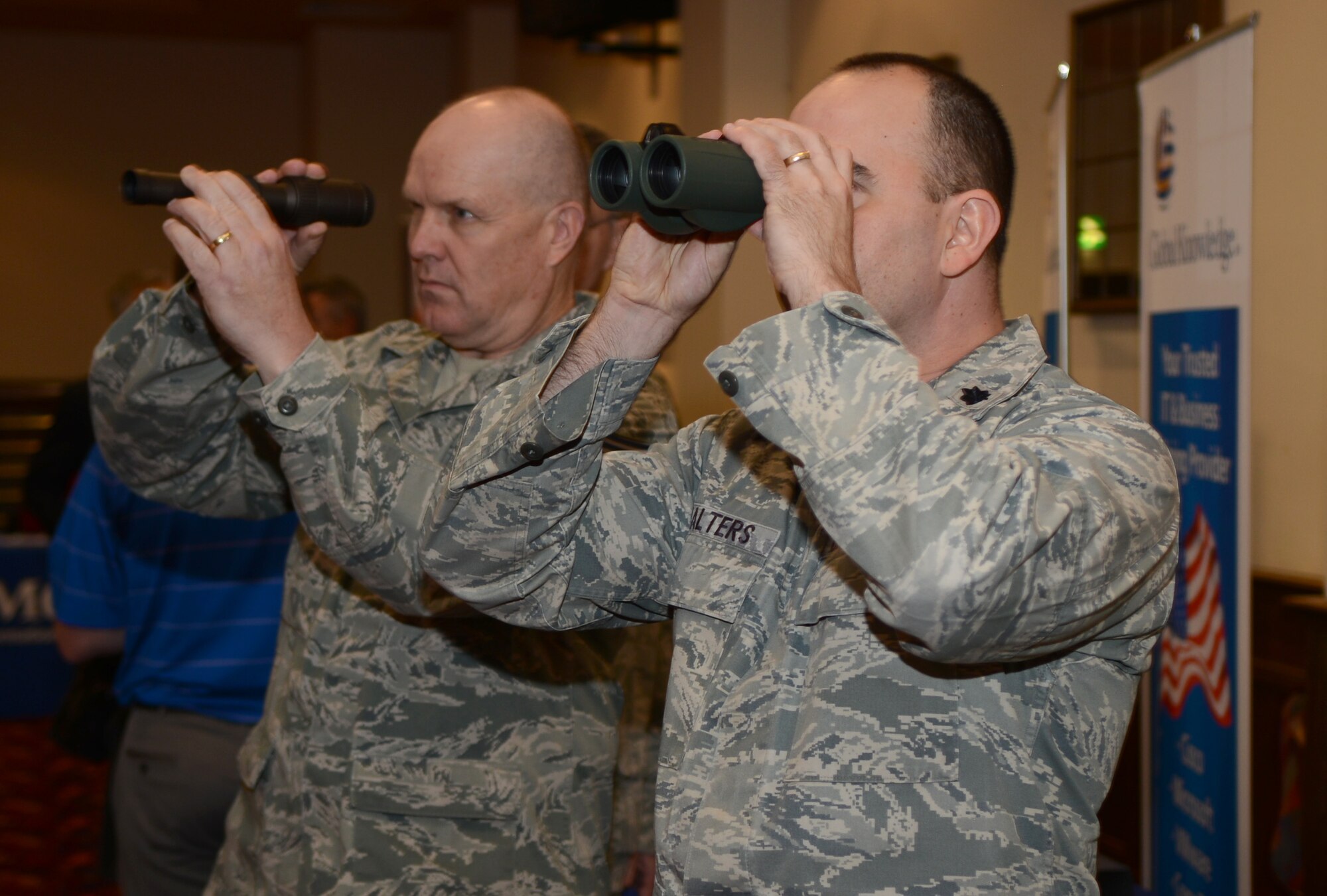 U.S. Air Force Lt. Col. Danny Walters, right, 100th Maintenance Group deputy commander, and U.S. Air Force Chief Master Sgt. David Lee, 100th MXG chief, test different optics May 15, 2014, during a technology expo on RAF Mildenhall, England. The exposition showcased more than 20 vendors from around the world. (U.S. Air Force photo by Airman 1st Class Dillon Johnston/Released)