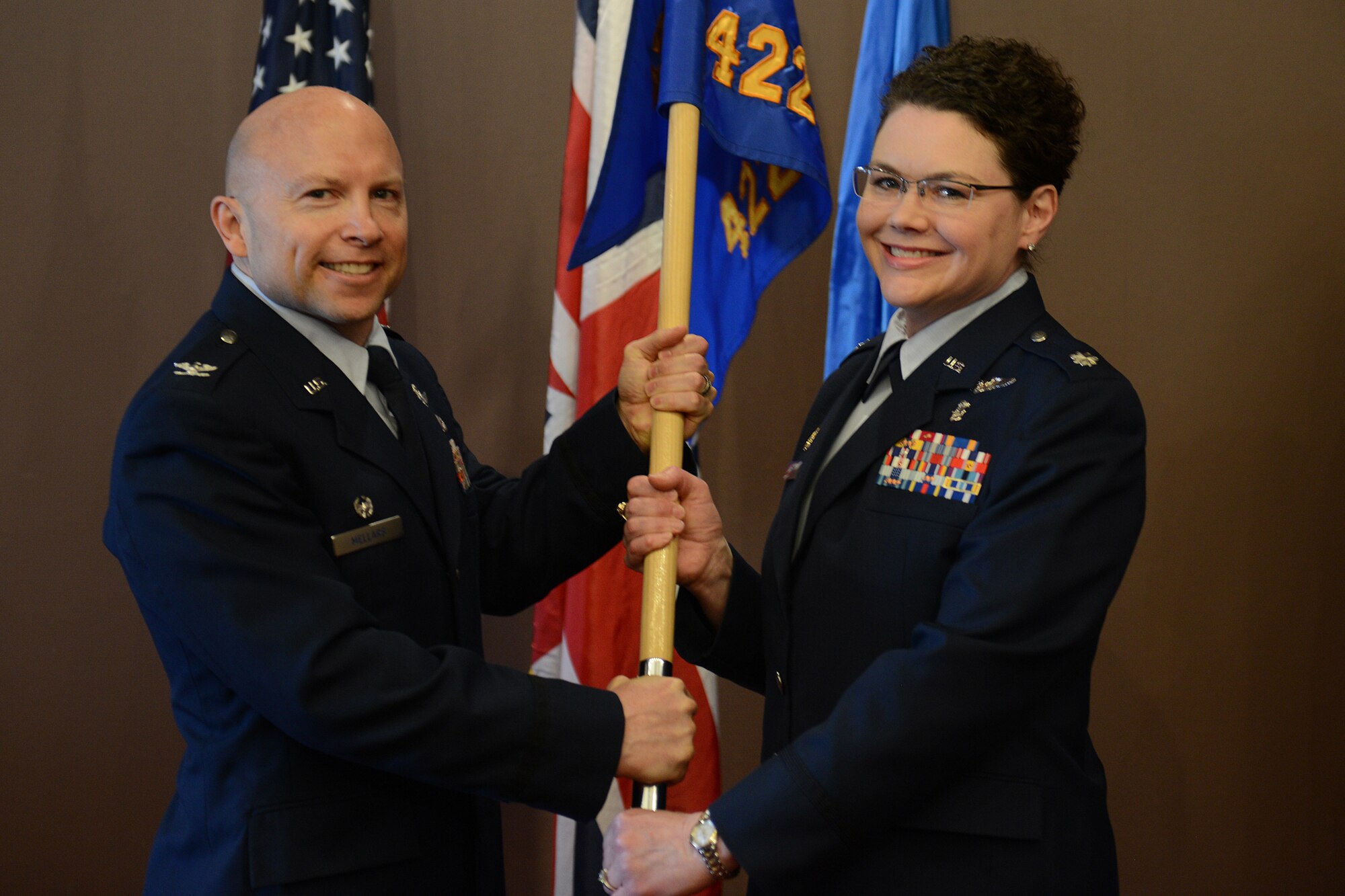 Lt. Col. Ingrid Ford assumes command of the 422nd Medical Squadron from Col. Douglas Mellars, 422nd Air Base Group commander, during a change of command ceremony at the RAF Croughton May 15. (U.S. Air Force photo by Tech. Sgt. Chrissy Best)