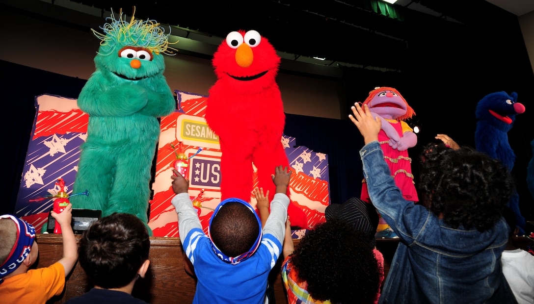 Joint Base Andrews families attend the Sesame Street/USO Experience for Military Families at Joint Base Andrews, Md., May 14, 2014. The seven month stateside tour began April 4 at Scott Air Force Base, Illinois, and is slated to perform more than 200 shows at 69 bases by the end of October.(U.S. Air Force photo/ Senior Airman Aaron Stout/released)