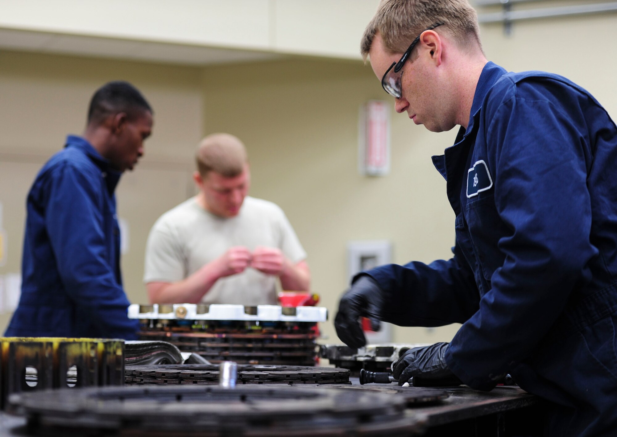Airman 1st Class Brian Pullen, a 19th Component Maintenance Squadron hydraulics apprentice, disassembles a C-130J brake for cleaning and inspection May 1, 2014, at Little Rock Air Force Base, Ark. The most common issue the hydraulics shop fixes is wear and tear of brake components. (U.S. Air Force photo by Senior Airman Kaylee Clark)