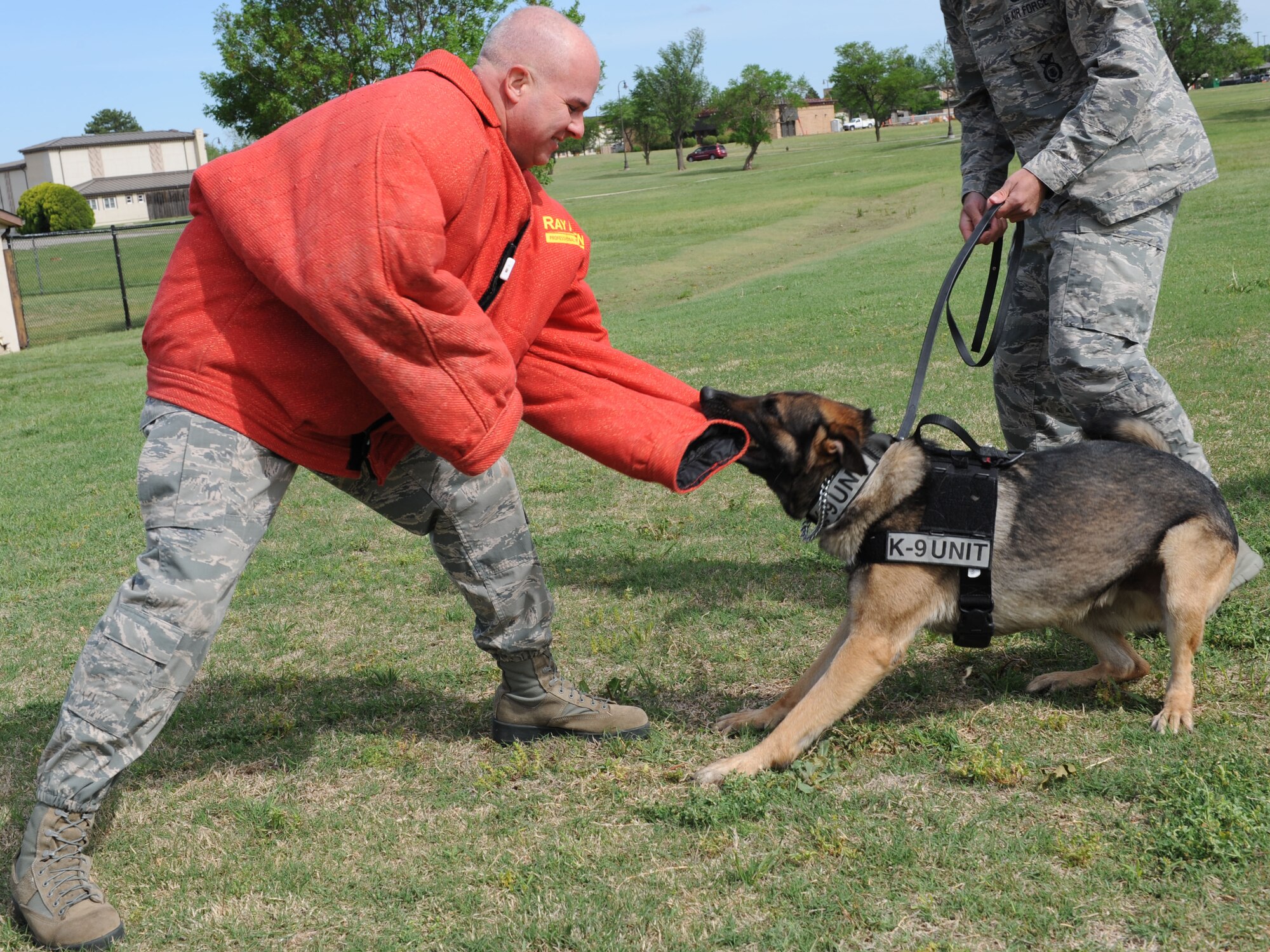 Chief Master Sgt. Michael Morris, 22nd Air Refueling Wing command chief, participates in a Redman suit demonstration, May 13, 2014, at McConnell Air Force Base, Kan. The demo was one of many 22nd Security Forces Squadron events held on base in celebration of National Police Week. (U.S. Air Force photo/Airman 1st Class David Bernal Del Agua)