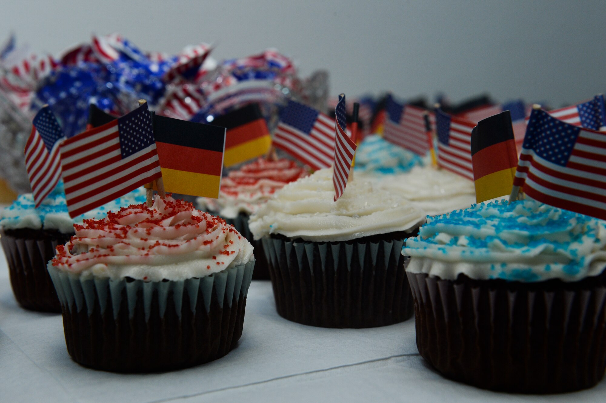 Cupcakes with German and American flags are displayed on a table at the end of a Host Nation Hospital Leader Tour May 14, 2014, at Spangdahlem Air Base, Germany. The 52nd Medical Group hosted the tour for German medical providers to strengthen partnerships. (U.S. Air Force photo by Senior Airman Rusty Frank/Released)