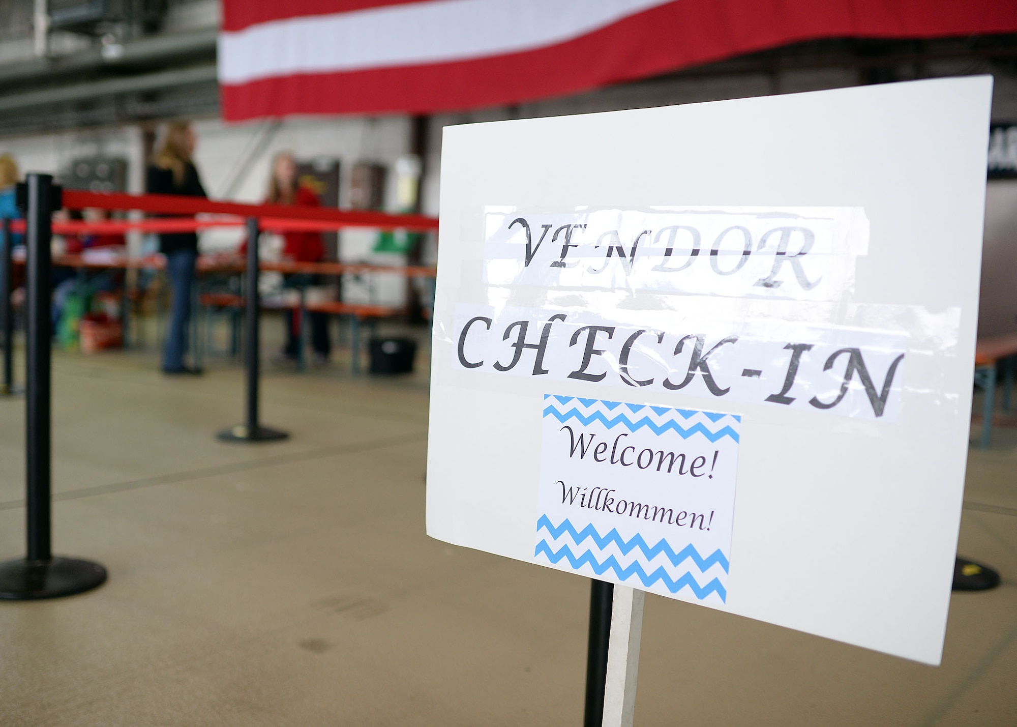 Vendors report to the check-in station in Hangar 1 during the Spring Bazaar setup May 15, 2014, at Spangdahlem Air Base, Germany. More than 100 vendors will set up booths to sell wares from nearly a dozen different countries. The Spangdahlem Spouses and Enlisted Members Club hosts the Spring Bazaar every year, and last year they raised more than $50,000 directly for the Spangdahlem community. (U.S. Air Force photo by Staff Sgt. Daryl Knee/Released)