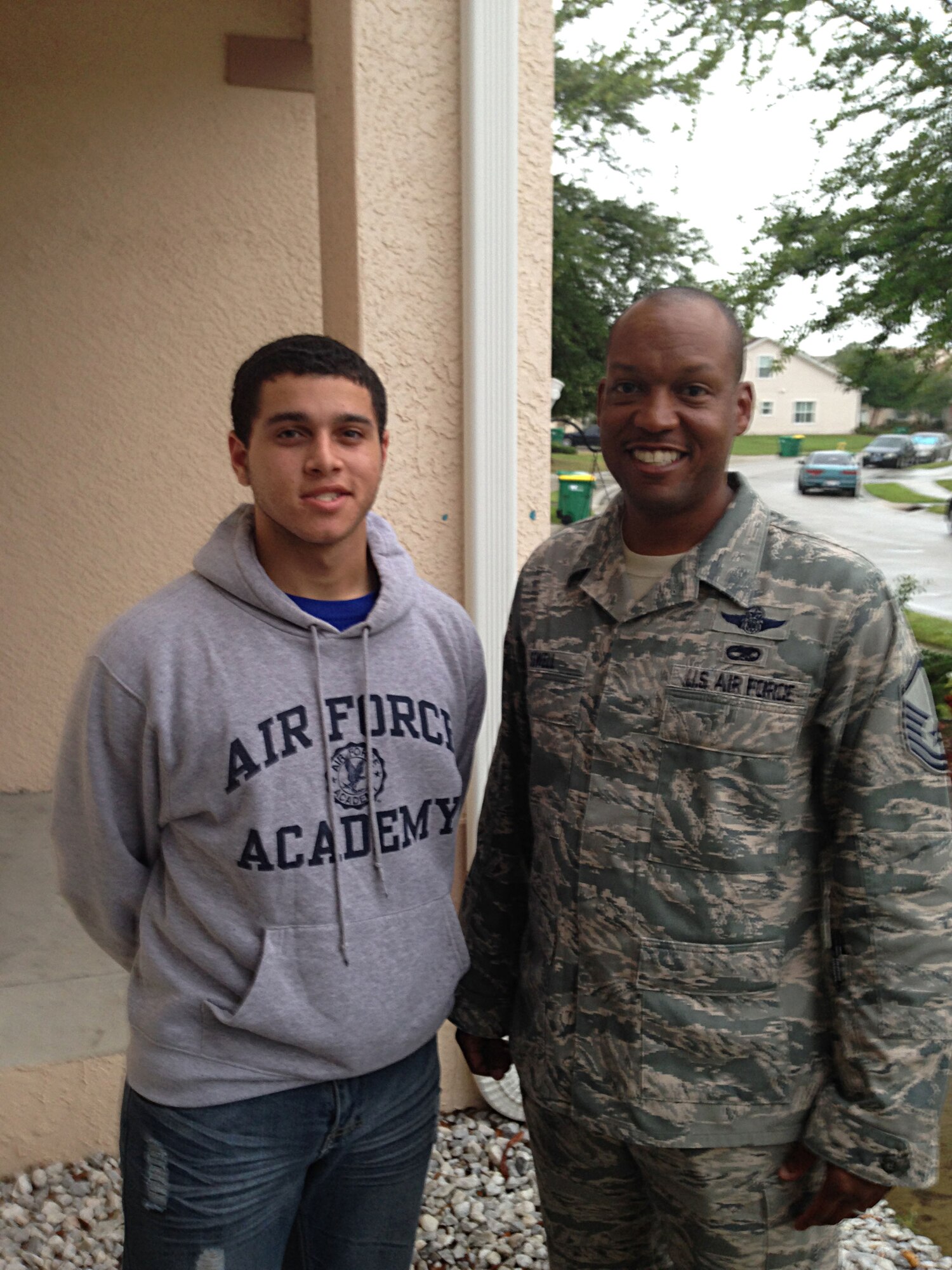 Master Sgt. Timothy Sewell and his son Michael Mendez pose for a photo. Mendez was accepted into the U.S. Air Force Academy March 20, 2014. (Courtesy photo)