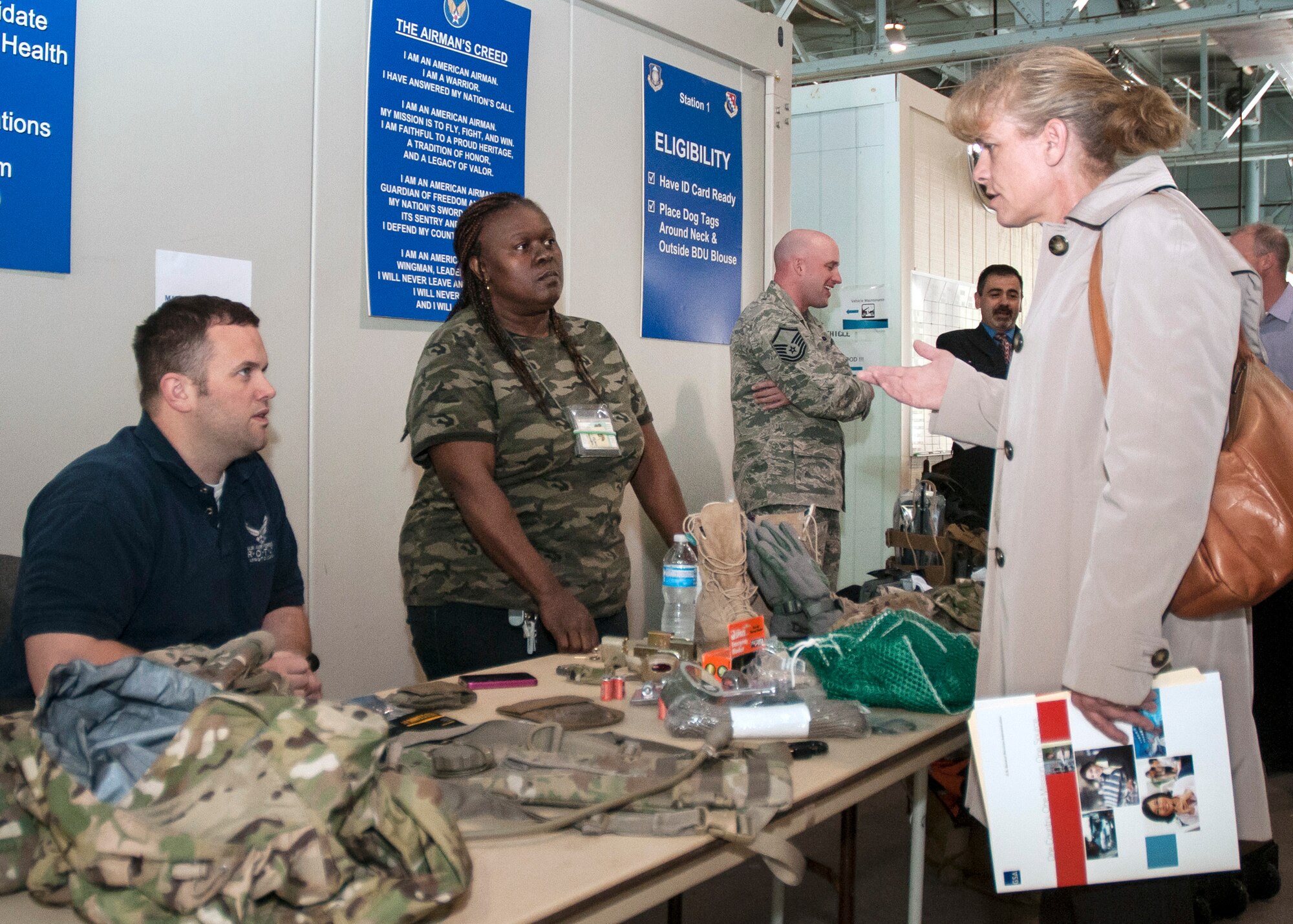 HANSCOM AIR FORCE BASE, Mass. – Karie A. Smithers (right), Joint Personal Property Shipping Office Personal Property Movement chief, speaks to Jared Carroll (sitting) and Linda Pevy, during the 66th Logistics readiness Squadron’s open house here May 14. Officials scheduled the open house to allow employees on base and with other federal government agencies in New England to see firsthand what services LRS offers to them. (U.S. Air Force photo by Walter Santos)