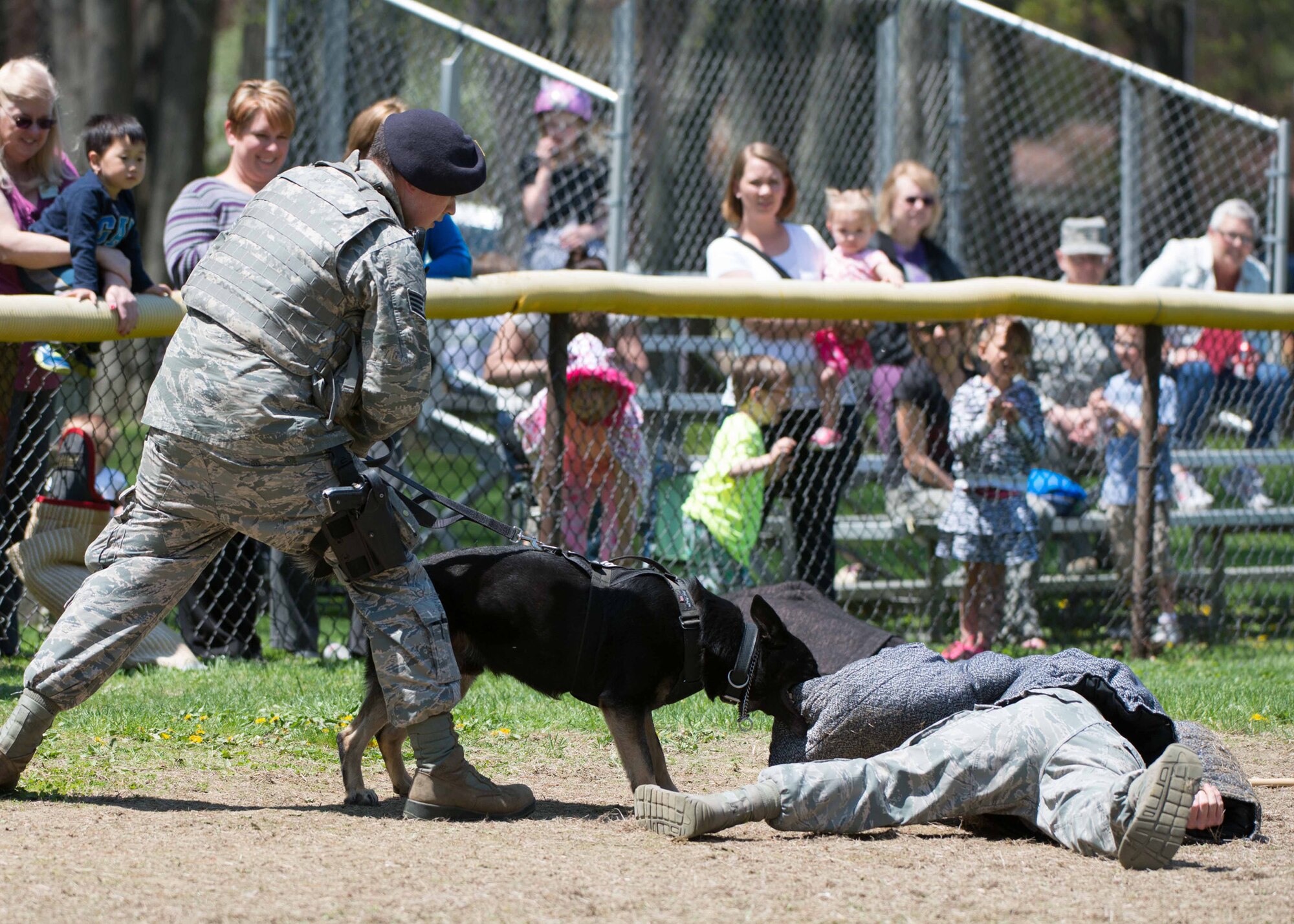 HANSCOM AIR FORCE BASE, Mass. – Sgt. Daniel Koski (left), 66th Security Forces Squadron, and his Military Working Dog Joell, provide a MWD demonstration to the community as part of Police Week on base May 14. The week-long recognition included an opening ceremony followed by a 5k fun run, a golf tournament, SFS equipment display at the Base Exchange and a retreat ceremony at the POW/MIA memorial area that featured Lincoln Police Chief Kevin A. Mooney as the guest speaker. (U.S. Air Force photo by Mark Herlihy)