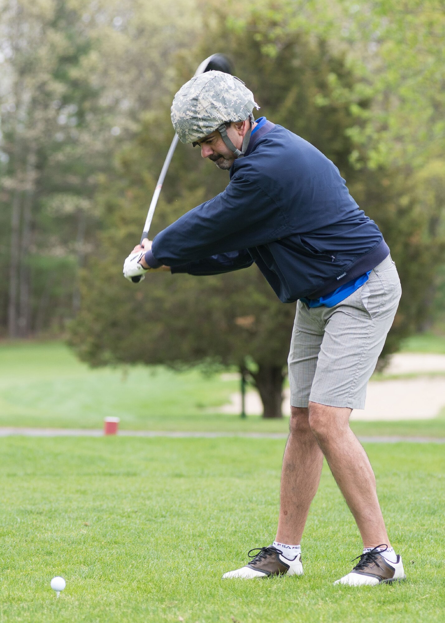 BEDFORD, Mass. – Donald Gonsalves, 66th Logistics Readiness Squadron director, tees off during a 66th Security Forces sponsored four-person golf tournament at the Patriot Golf Course May 13 as part of Police Week activities scheduled May 12 through 18. During the golf tournament, each hole presented a unique police-themed challenge to golfers. A closing ceremony and charity barbecue is scheduled May 16 at 12 noon at Castle Park. Donations will be accepted with all proceeds going to the Air Force Security Police Association and National Law Enforcement Memorial Fund charities. The barbecue includes burgers, brats, chips, cole slaw and a choice of cold beverages. (U.S. Air Force photo by Mark Herlihy)