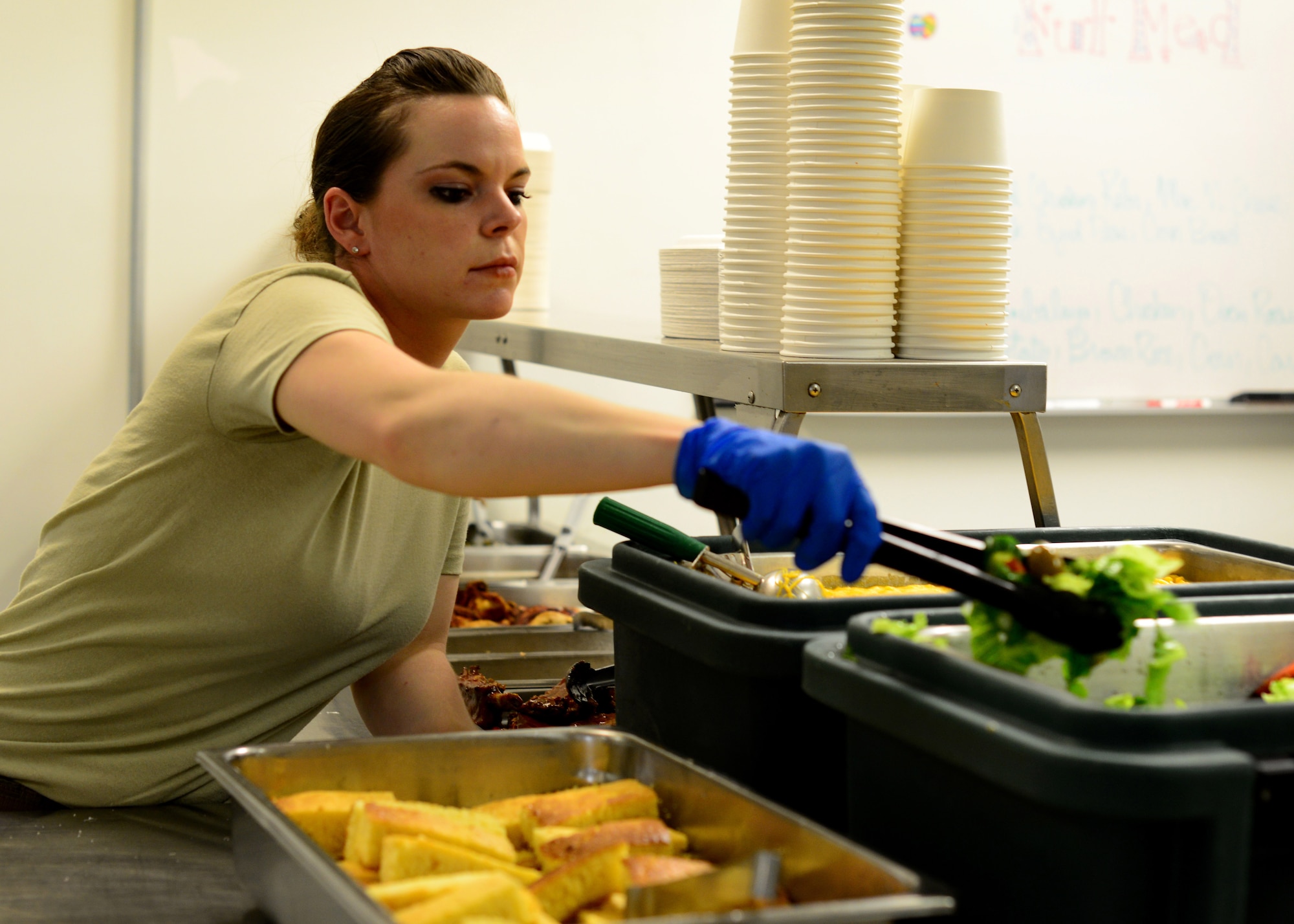 Staff Sgt. Dawn Spence, 455th Expeditionary Medical Support Squadron nutritional medicine diet technician prepares meal trays for patients May 13 at Bagram Airfield, Afghanistan.  As part of nutritional medicine, Spence provides nutritional care and quality foodservice while promoting military readiness and community wellness.  Spence is deployed from Lackland Air Force Base, Texas and a native of Paradise, Calif. (U.S. Air Force photo by Staff Sgt. Evelyn Chavez/Released)
