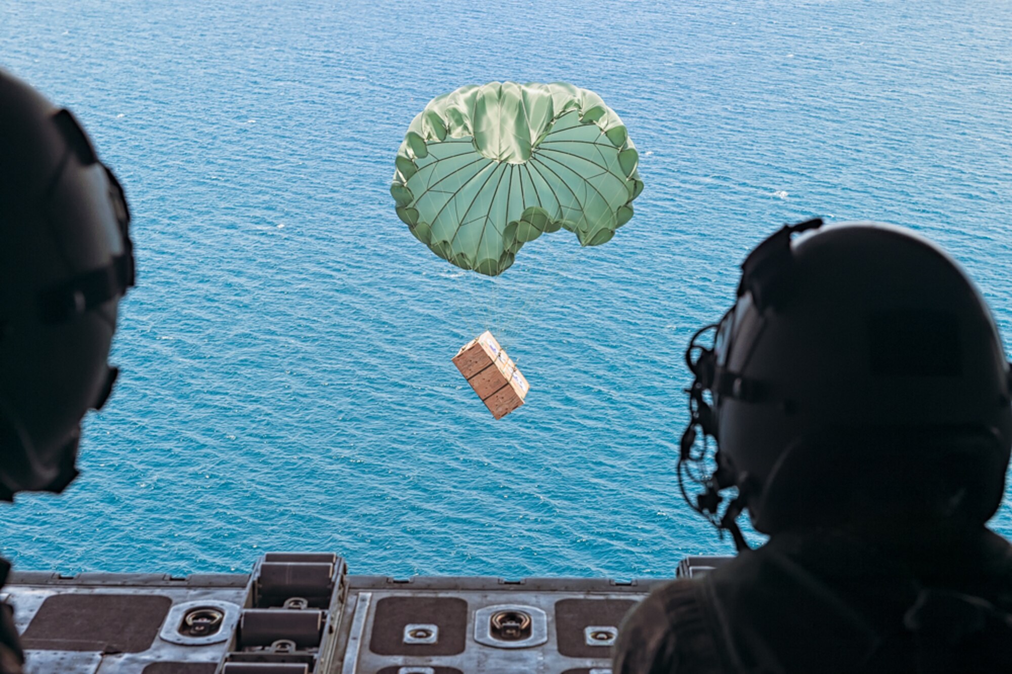 A low-cost, low-altitude (LCLA) bundle exits a C-130H aircraft assigned to the 36th Airlift Squadron, Yokota Air Base, Japan, during Exercise Balikatan near Subic Bay, Republic of the Philippines May 14, 2014. Aircrews from the 36th AS demonstrated the unique LCLA airdrop technique alongside Republic of the Philippine counterparts in order to practice the ability to deliver humanitarian aid and supplies to remote regions. (Courtesy photo by U.S. Air Force Maj. Teodoro Apalisok)