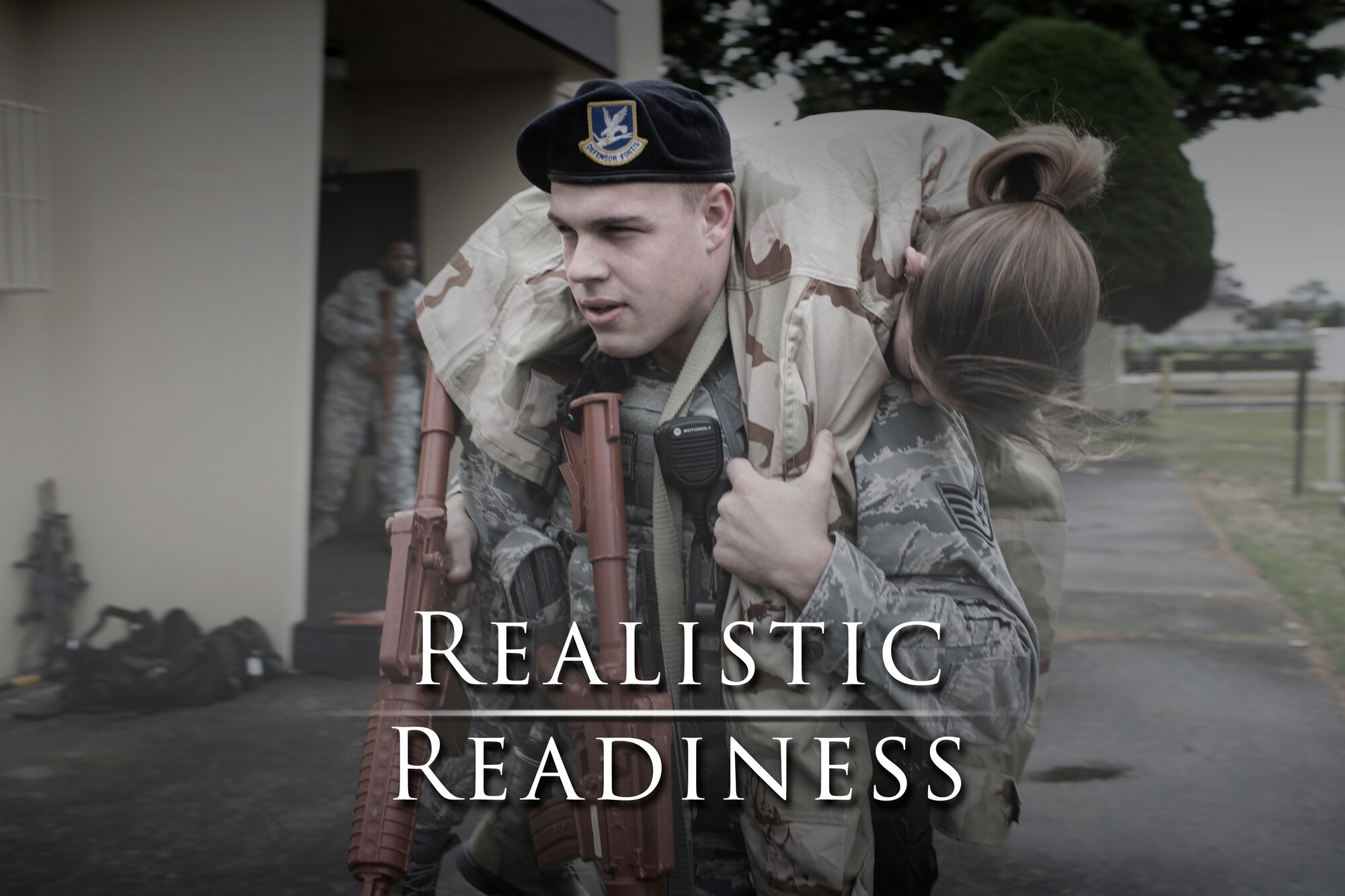 Staff Sgt. Anthony Hayes, 374th Security Forces Squadron patrolman, performs a fireman’s carry during a simulated active shooter scenario at Yokota Air Base, Japan, May 15, 2014. The scenario tested the capability of Yokota’s first responders. (U.S. Air Force photo illustration by Osakabe Yasuo/Released)