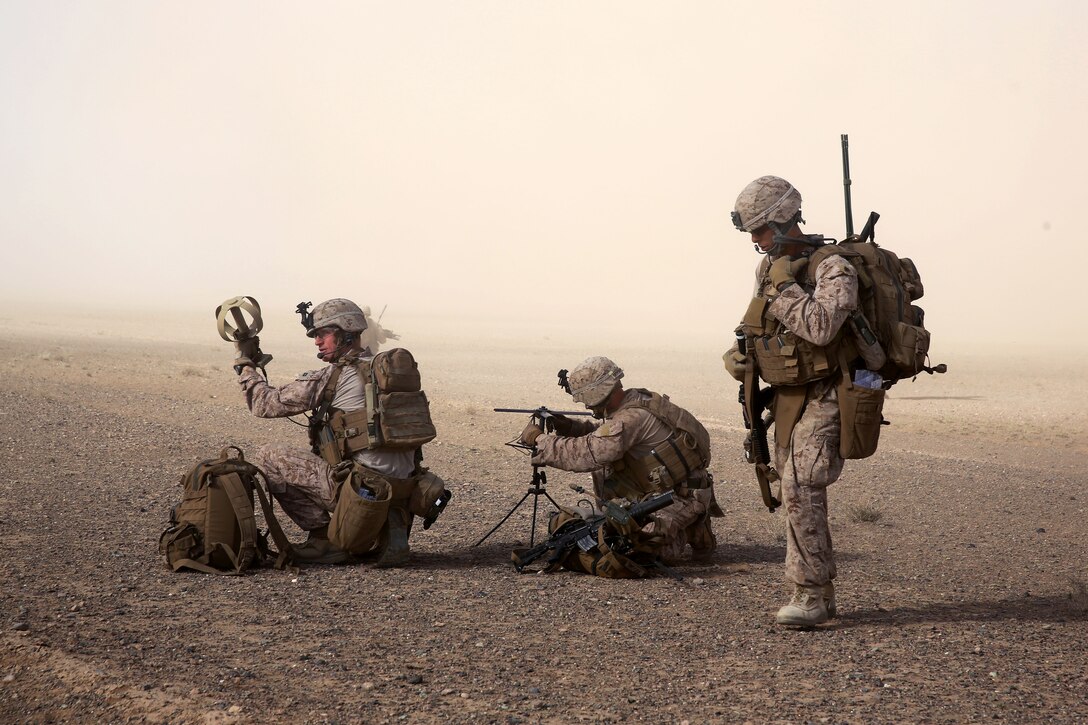 U.S. Marines establish radio communication during a mission in Afghanistan's Helmand province, May 2, 2014. The Marines are assigned to Weapons Company, 1st Battalion, 7th Marine Regiment.