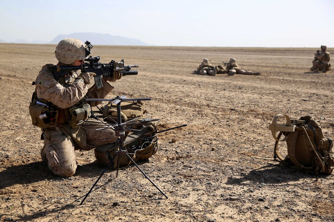 U.S. Marine Corps Cpl. Mathew Moore provides security during a mission in Afghanistan's Helmand province, May 2, 2014. Moore, a field radio operator, is assigned to Weapons Company, 1st Battalion, 7th Marine Regiment.