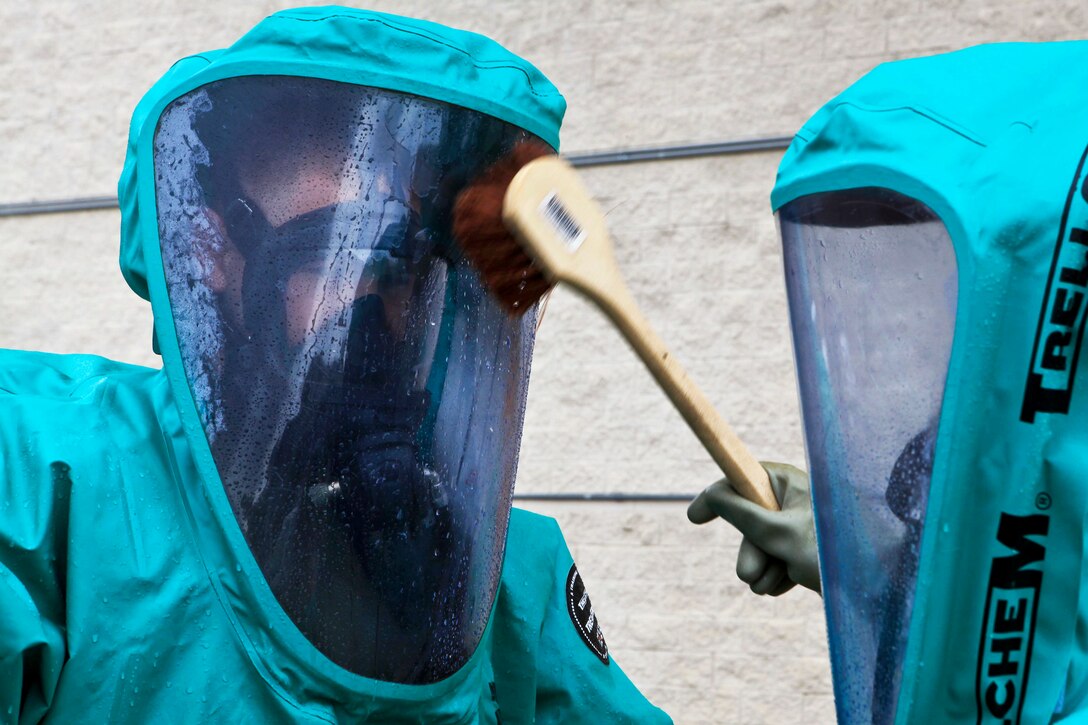 Marine Corps chemical, biological, radiological and nuclear defense specialists perform decontamination procedures during a training exercise on Marine Corps Air Station Miramar, San Diego, April 30, 2013. The Marines took part in training to increase mission readiness and rehearse standard operating procedures. The specialists are assigned to Marine Wing Headquarters Squadron 3, 3rd Marine Aircraft Wing.  
