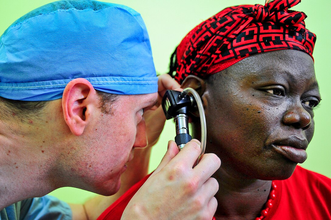 U.S. Army Capt. Jamie Andrews uses an otoscope to examine a patient's eardrum during a training exercise as part of New Horizons 2013 at Western Regional Hospital in Belmopan, Belize, April 23, 2013. Andrews, a resident physician, is assigned to Brooke Army Medical Center in San Antonio.  
