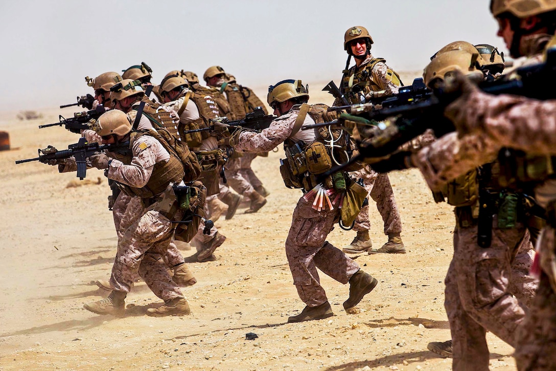 U.S. Marines fire M4 carbines while conducting a marksmanship training exercise at a range in Al Galail, Qatar, April 22, 2013. The Marines are assigned to the 26th Marine Expeditionary Unit's Maritime Raid Force.  
