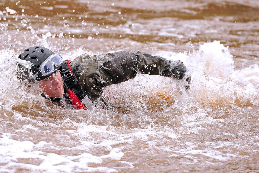 Air Force Staff Sgt. Daniel Holmes conducts swift water rescue training during exercise Angel Thunder 2013 near Davis-Monthan Air Force Base, Ariz., April 10, 2013. Holmes, a pararescueman, is assigned to the 48th Rescue Squadron.  

