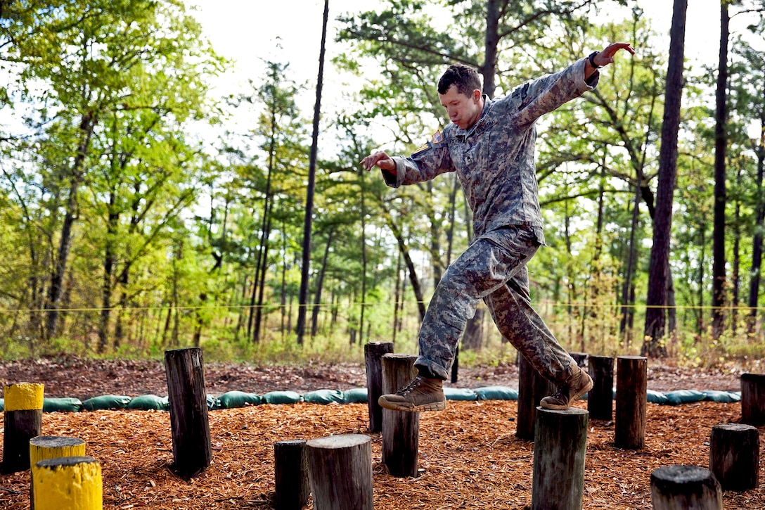 Army Staff Sgt. Christopher Peiffer moves through the "island hopper" obstacle during the 30th annual Best Ranger Competition on Fort Benning, Ga., April 12, 2013. Peiffer is assigned to the 75th Ranger Regiment.  
