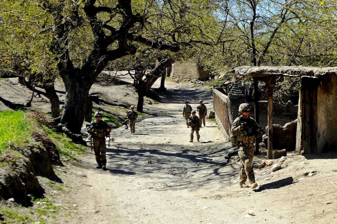 U.S. soldiers conduct a patrol through a local bazaar in the Khogyani district of Afghanistan’s Nangarhar province, March 30, 2013.  
