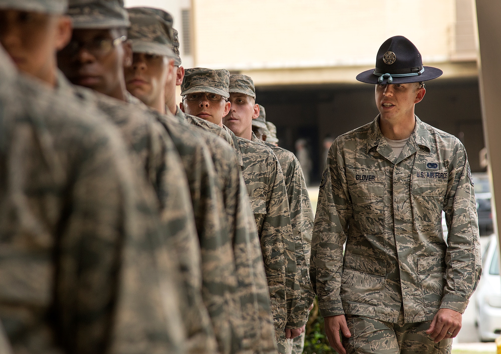 Staff Sgt. Eddie Glover, insures that a flight of basic trainees are properly aligned in formation at the 322nd Training Squadron April 17, at Joint Base San Antonio-Lackland. (U.S. Air Force photo by Benjamin Faske)