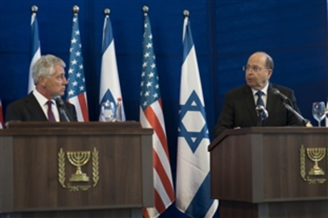 U.S. Defense Secretary Chuck Hagel, left, holds a press conference with Israeli Defense Minister Moshe Yaalon in Tel Aviv, Israel, May 15, 2014. The two defense leaders discussed the continued partnership between Israel and the United States, and answered questions from U.S. and  Israeli and reporters.