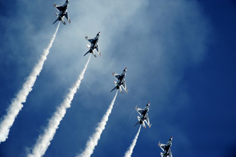 The Thunderbirds climb for a Line Break Loop maneuver during an open house presentation at Joint Base McGuire-Dix-Lakehurst, N.J. The Thunderbirds are the Air Force precision flying demonstration team that flies red, white and blue F-16 Fighting Falcons. (U.S. Air Force photo/Staff Sgt. Larry E. Reid Jr.)