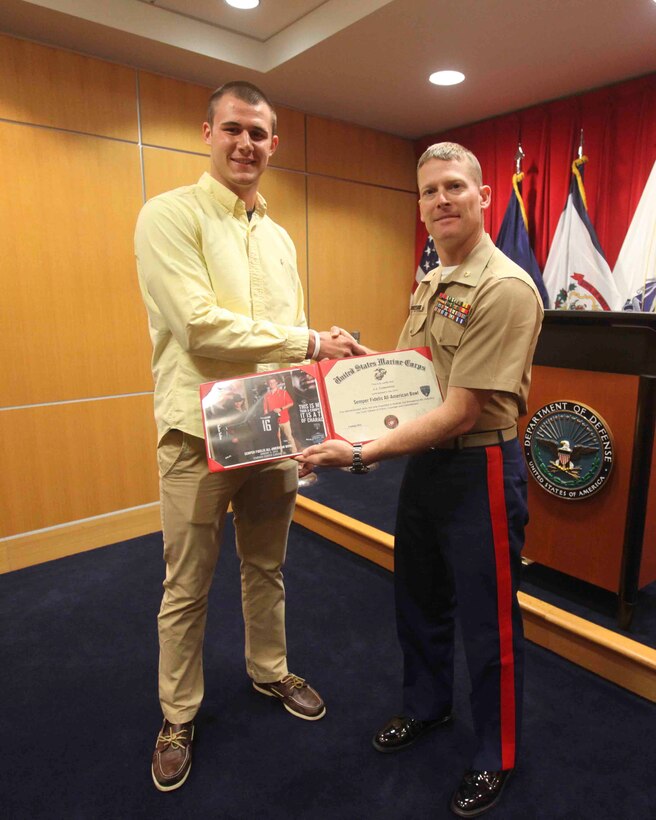 PITTSBURGH--Joseph Cosentino, a native of Pittsburgh and a graduate of Pittsburgh Central Catholic high school, received a Certificate of Appreciation for playing in the 2013 Semper Fidelis All-American Bowl from Maj. John Hunt, commanding officer of the United States Marine Corps Recruiting Station Pittsburgh, May 15. Following his senior year of high school Cosentino is slated to play for Florida State University, the champions of the 2013 college football season, as a quarterback. (U.S. Marine Corps photo by Lance Cpl. Brandon Thomas)