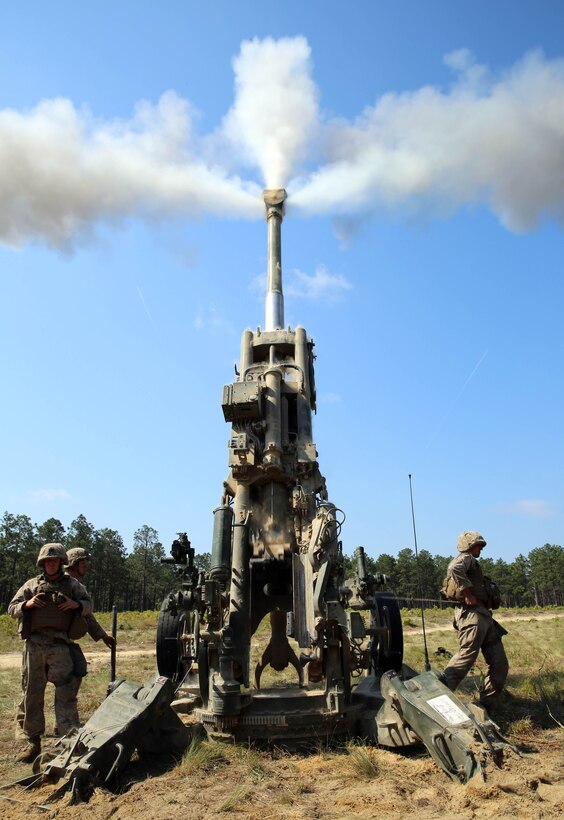 Marines with Golf Battery, 2nd Battalion, 10th Marine Regiment, 2nd Marine Division, employ the M-777 lightweight 155 mm howitzer during a competition for the title of Top Gun as part of Rolling Thunder held at Fort Bragg, N.C., May 7, 2014. Rolling Thunder is a biannual field operation in which Marines learn to be more proficient at effectively employing their respective weapons systems.