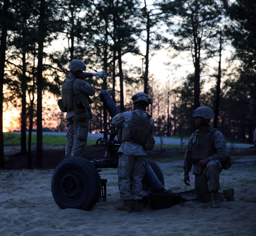Marines with Golf Battery, 2nd Battalion, 10th Marine Regiment, prepare to load and fire the M-327 120mm towed rifled mortar expeditionary fire support system during training with Marines from Delta Company, 2nd Assault Amphibian Battalion, 2nd Marine Division, aboard Fort Bragg, N.C., May 8, 2014. The training was a part of the field operation Rolling Thunder, a semiannual event in which Marines learned to be more proficient at effectively employing their respective weapons systems.
