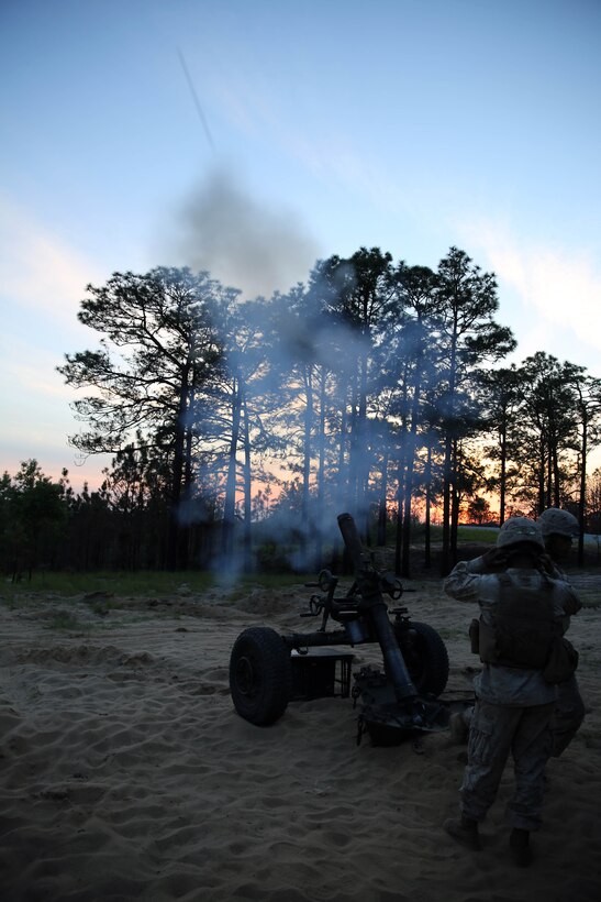 Marines with Golf Battery, 2nd Battalion, 10th Marine Regiment, 2nd Marine Division, fire an M-327 120mm towed rifled mortar expeditionary fire support system for training during the field operation Rolling Thunder aboard Fort Bragg, N.C., May 8, 2014. During this training, the Marines worked with Marines from 2nd Assault Amphibian Battalion, 2nd Marine Division in order to become more technically and tactically proficient in the utilization of their assault amphibious vehicles.