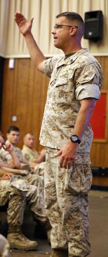 Master Gunnery Sgt. Chad Ramsey, operations chief for 2nd Reconnaissance Battalion, 2nd Marine Division, informs Marines from the various regiments within the Division and their subordinate battalions of different aspects and requirements for being a reconnaissance Marine at the base theatre aboard Marine Corps Base Camp Lejeune, N.C., May 15, 2014.To become a reconnaissance Marine, Marines must first go through the basic reconnaissance course, a three phased course that hones in on reconnaissance individual and special skills, individual and team ocean amphibious skills and team communications and patrolling skills.