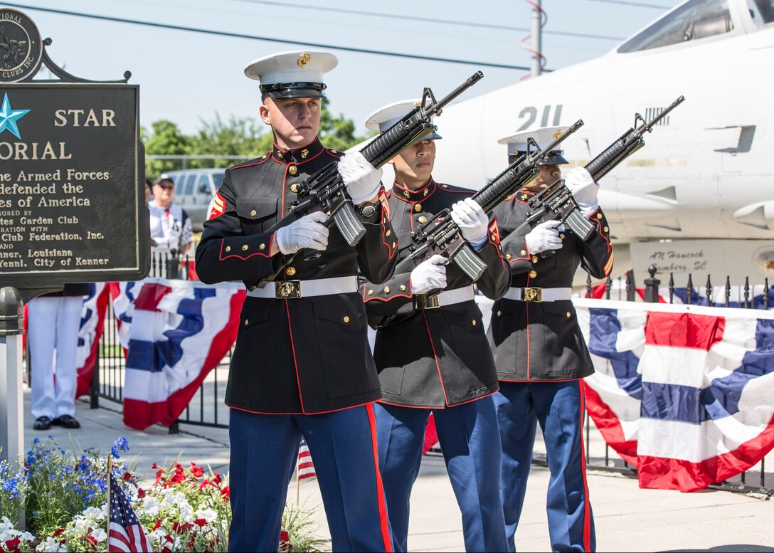 A Marine Forces Reserve rifle team fires a twenty-one-gun salute to honor veterans of the Vietnam War during a ceremonial display of the Vietnam Veterans Memorial Moving Wall in Kenner, Louisiana, May 16, 2014. The moving wall is designed to give those who cannot make the trip to see the actual Vietnam Veterans Memorial Wall in Washington, District of Columbia, the opportunity to view it. Vietnam veterans built the moving wall replica and it has been traveling the country for more than 30 years.