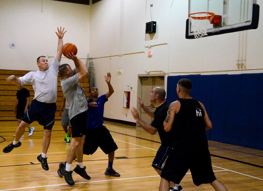 366th Logistics Readiness Squadron plays a game of basketball as a challenge between an LRS flight and the LRS Command-Support Section at Mountain Home Air Force Base, Idaho, May 5, 2014. “When Airmen get the opportunity to mix it up with their squadron leadership it helps build trust and unit camaraderie,” said Lt. Col. Jensen 366th LRS commander. (U.S. Air Force photo by Airman 1st Class Devin Nothstine/RELEASED)