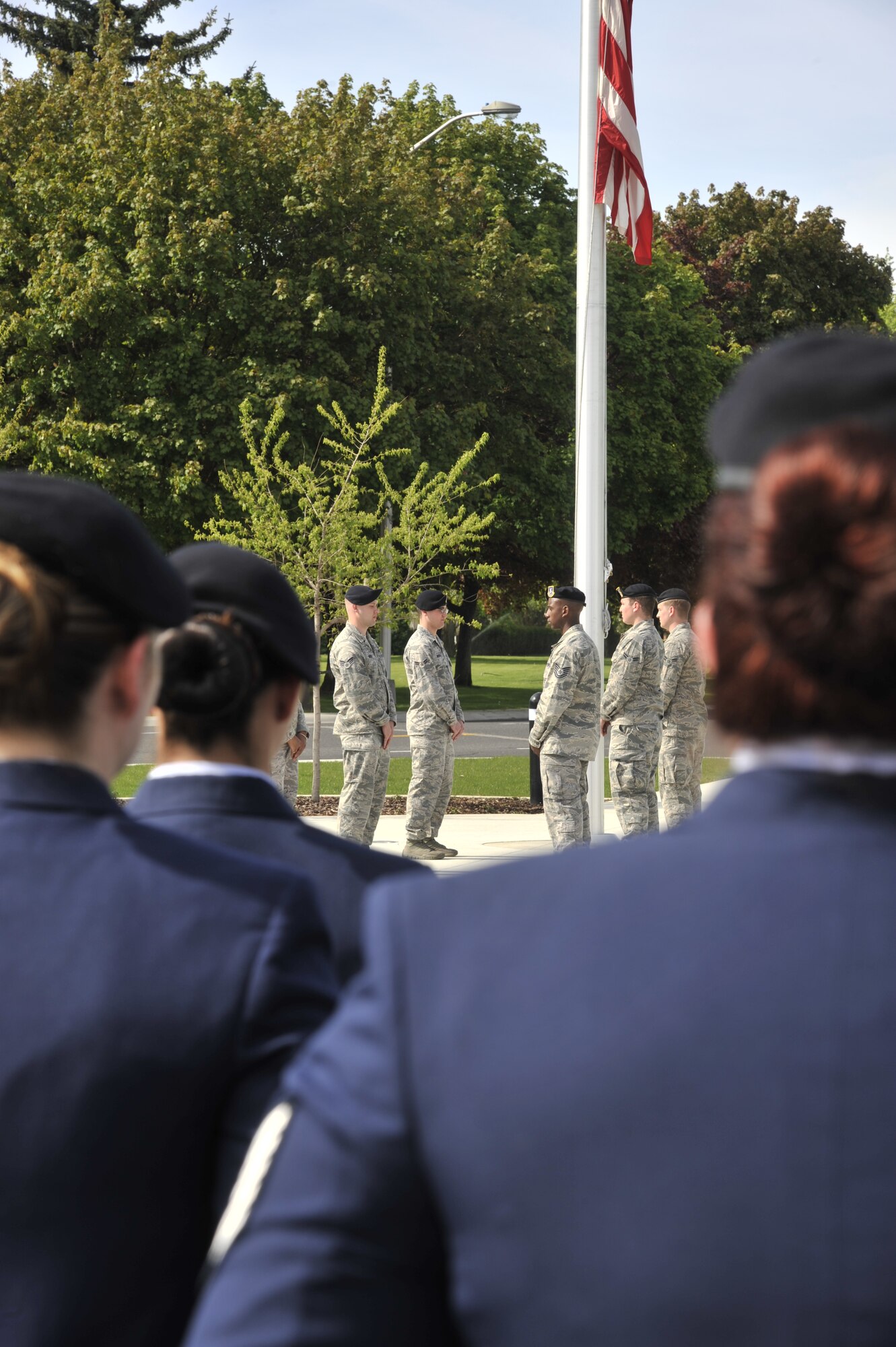 Airmen from the 92nd Security Forces Squadron prepare to perform ceremonial retreat functions to conclude events held during National Police Week at Fairchild Air Force Base, Wash., May 15, 2014. This week recognizes the service and sacrifice of U.S. law enforcement officers who lost their lives ensuring America's safety and protection. (U.S. Air Force photo by Senior Airman Mary O'Dell/Released)