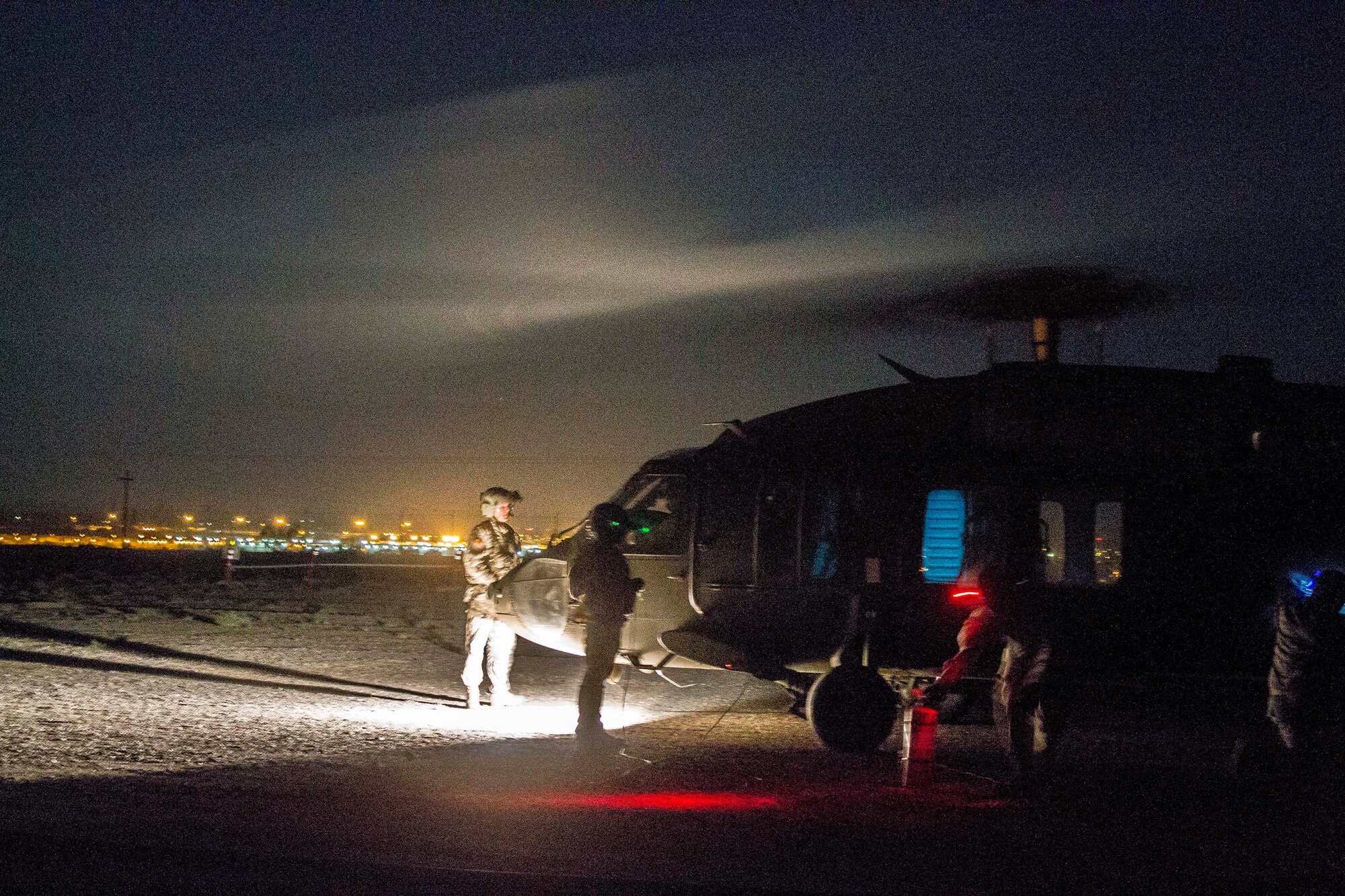 An Arizona Army National Guard 2-285 UH-60 Black Hawk helicopter conducts refueling at a Forward Arming and Refueling Point during a training mission in Exercise ANGEL THUNDER on May 14, 2014 at the Florence Military Reservation, Ariz. ANGEL THUNDER 2014 is the largest and most realistic joint service, multinational, interagency combat search and rescue exercise designed to provide training for personnel recovery assets using a variety of scenarios to simulate deployment conditions and contingencies. Personnel recovery forces will train through the full spectrum of personnel recovery capabilities with ground recovery personnel, air assets, and interagency teams. (U.S. Air Force photo by Maj. Sarah Schwennesen/Released) 