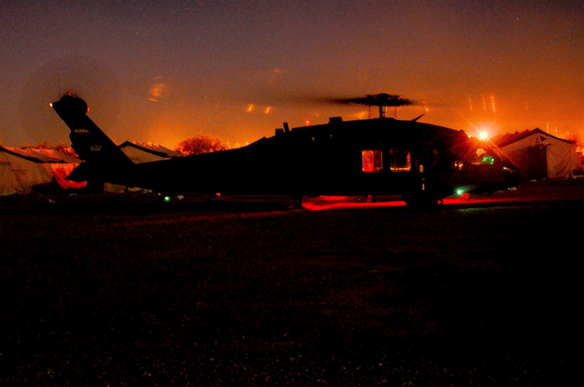 A UH-60 Black Hawk helicopter conducts refueling at a Forward Arming and Refueling Point during a training mission in Exercise ANGEL THUNDER on May 14, 2014 at the Florence Military Reservation, Ariz. ANGEL THUNDER 2014 is the largest and most realistic joint service, multinational, interagency combat search and rescue exercise designed to provide training for personnel recovery assets using a variety of scenarios to simulate deployment conditions and contingencies. Personnel recovery forces will train through the full spectrum of personnel recovery capabilities with ground recovery personnel, air assets, and interagency teams. (U.S. Air Force photo by Staff Sgt. Adam Grant/Released)
