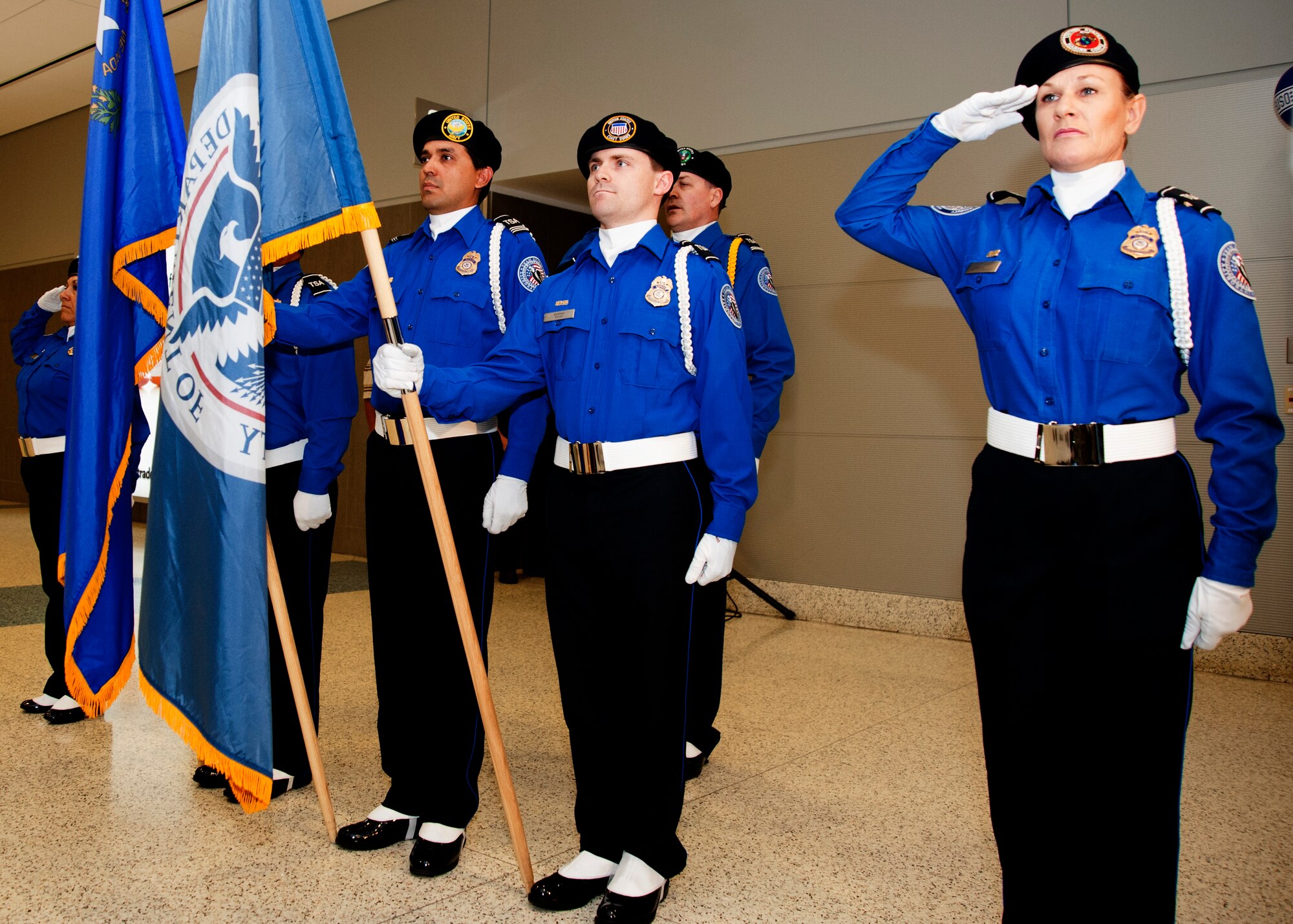 Transportation Security Administration Honor Guard members present the colors before the grand opening ceremony for a new USO lounge at McCarran International Airport’s Terminal 3 May 7, 2014. Nearly 27,000 people volunteer annually at 96 USO lounges in the United States and 18 lounges overseas, some of which are open 24 hours a day. (U.S. Air Force photo by Tech. Sgt. S.E./Released)