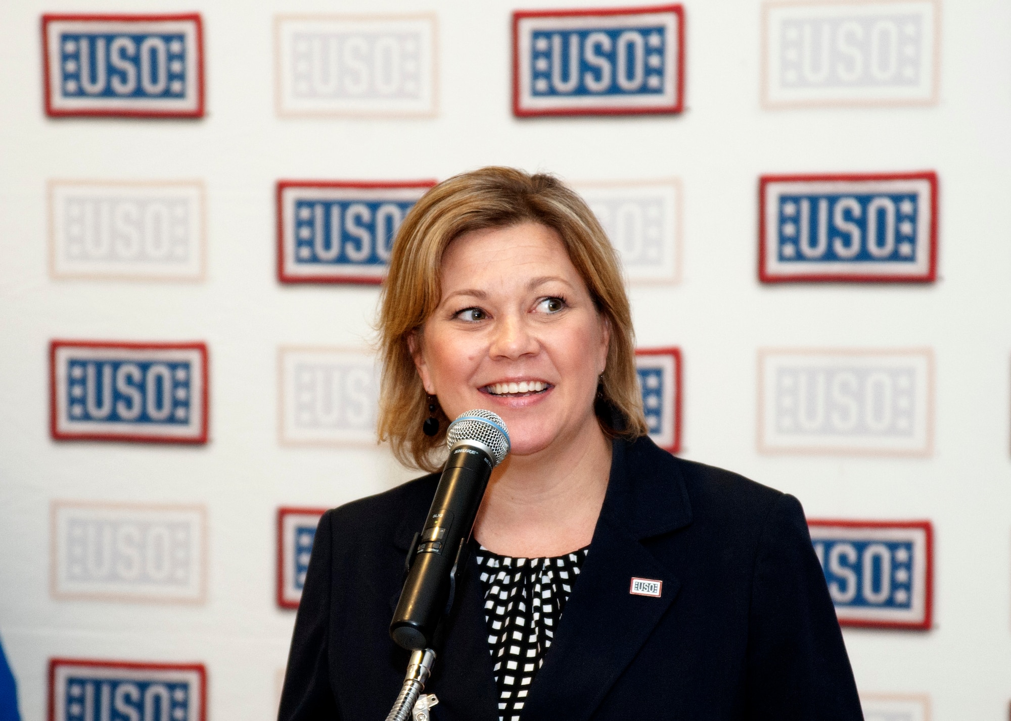 Jennifer Earl, USO Las Vegas center director, gives opening statements during the grand opening for a new USO lounge at McCarran International Airport’s Terminal 3 May 7, 2014. The USO was created in 1941, and the organization’s mission is to lift the spirits of America’s troops and their families. (U.S. Air Force photo by Tech. Sgt. S.E./Released)
